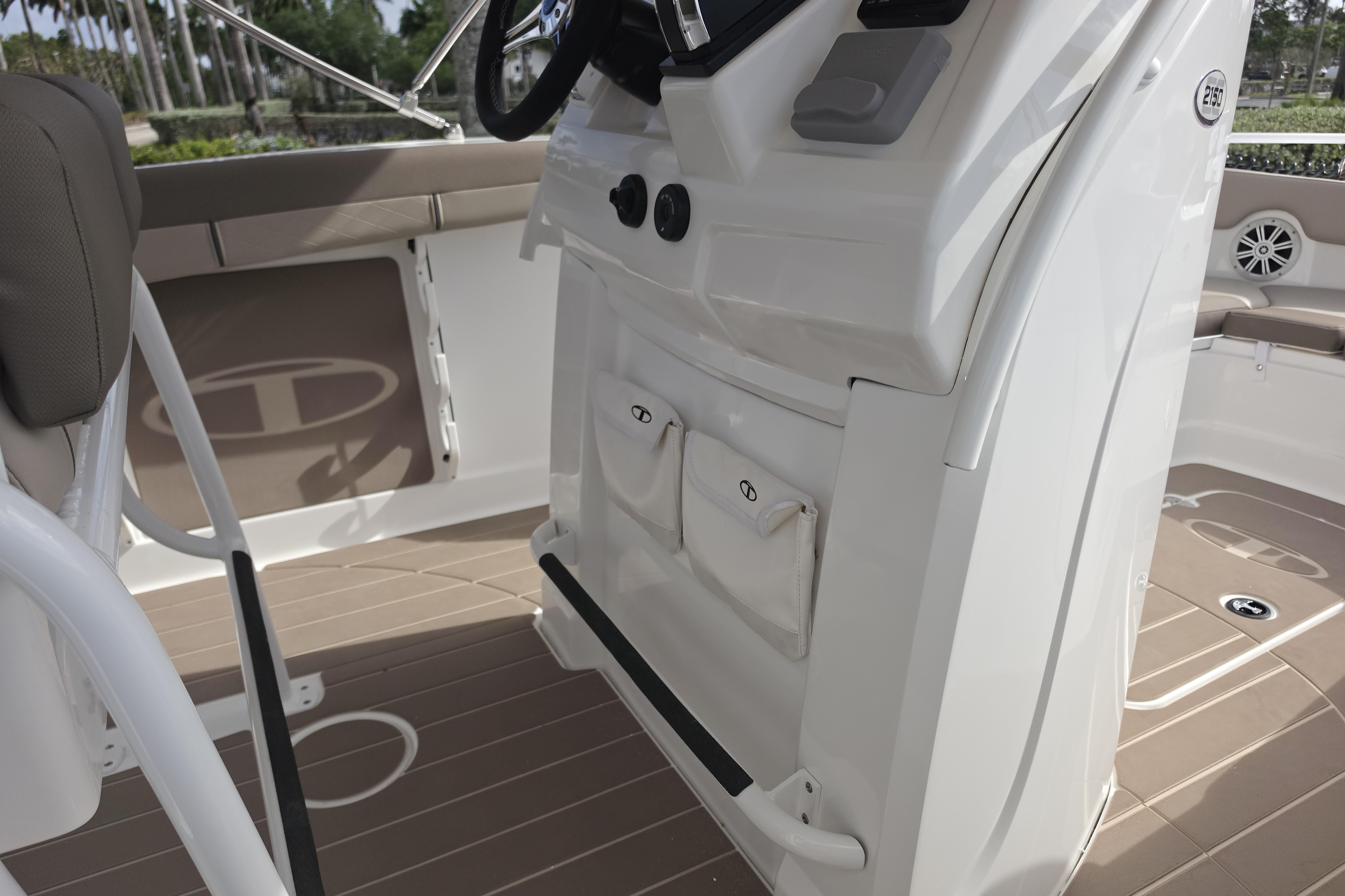 Interior view of 2026 Tahoe 2150 CC boat, featuring helm and seating area.