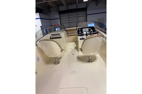 2021 Scout 215 Dorado boat interior with dual helm seats and steering console.