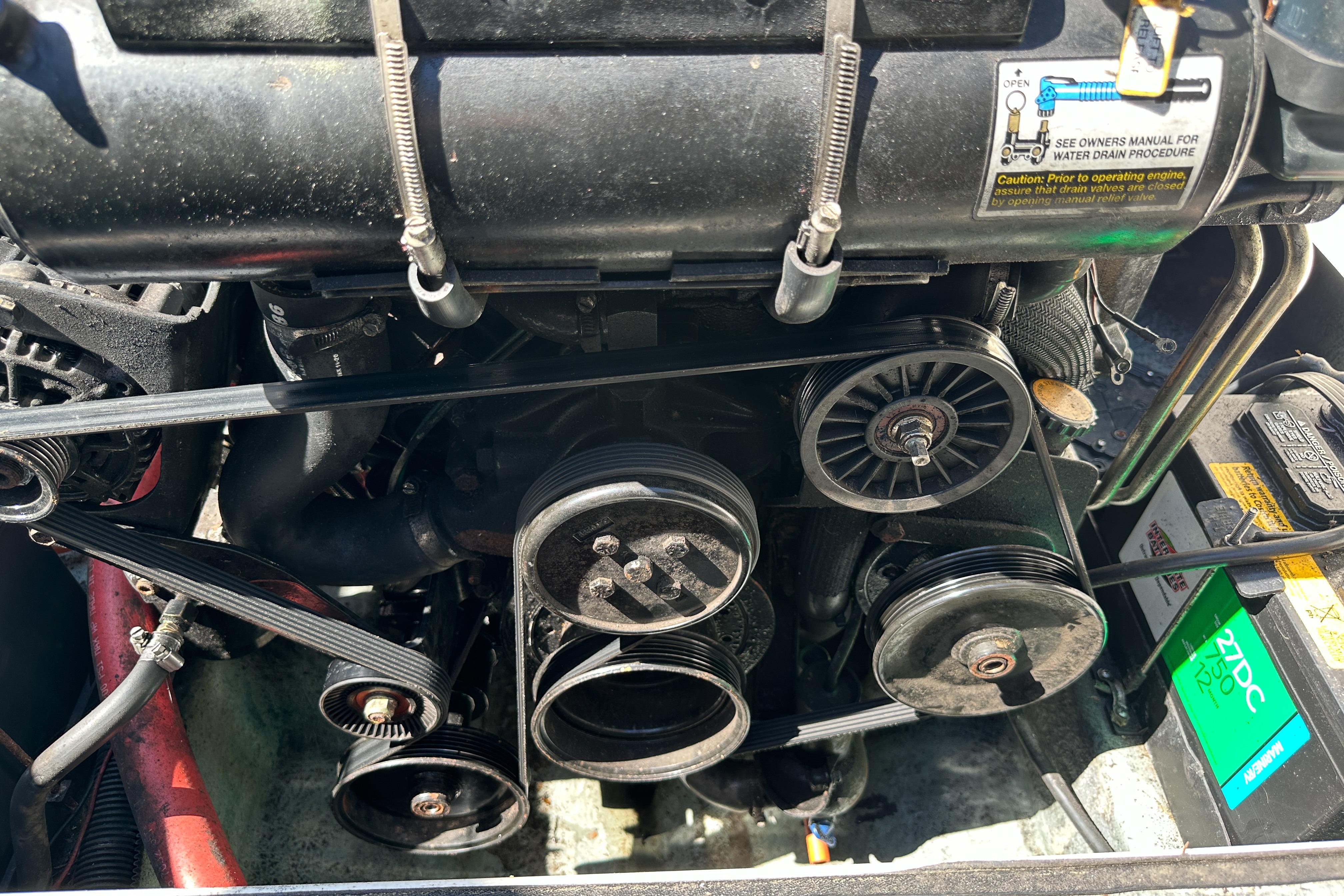 Engine components of a 1998 Sea Ray 215 Express Cruiser boat.