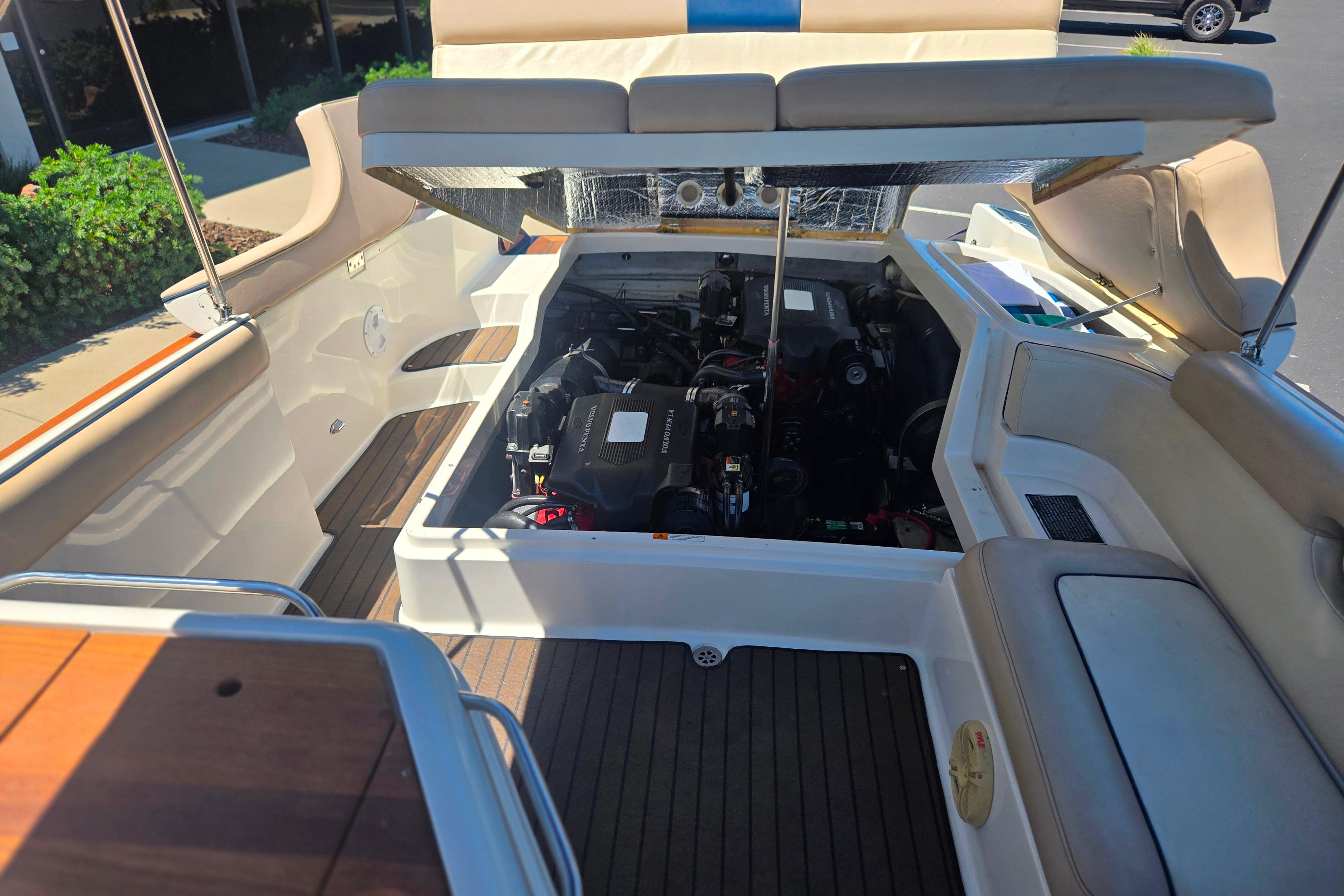2002 Chris-Craft Launch 28 GT I/O boat engine compartment with open hatch.