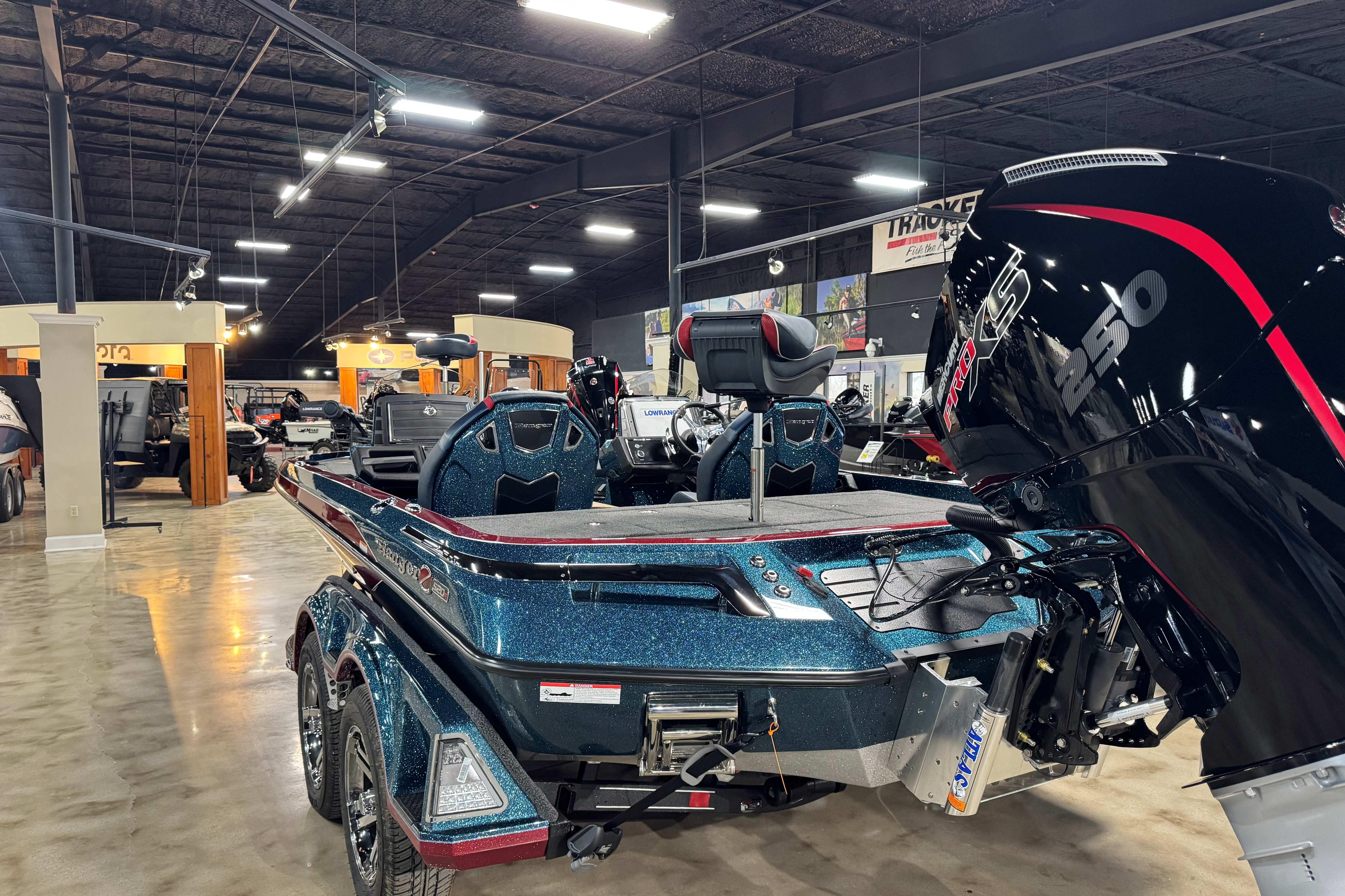 2025 Ranger Z520R Cup-Equipped boat in showroom, featuring powerful engine and sleek design.