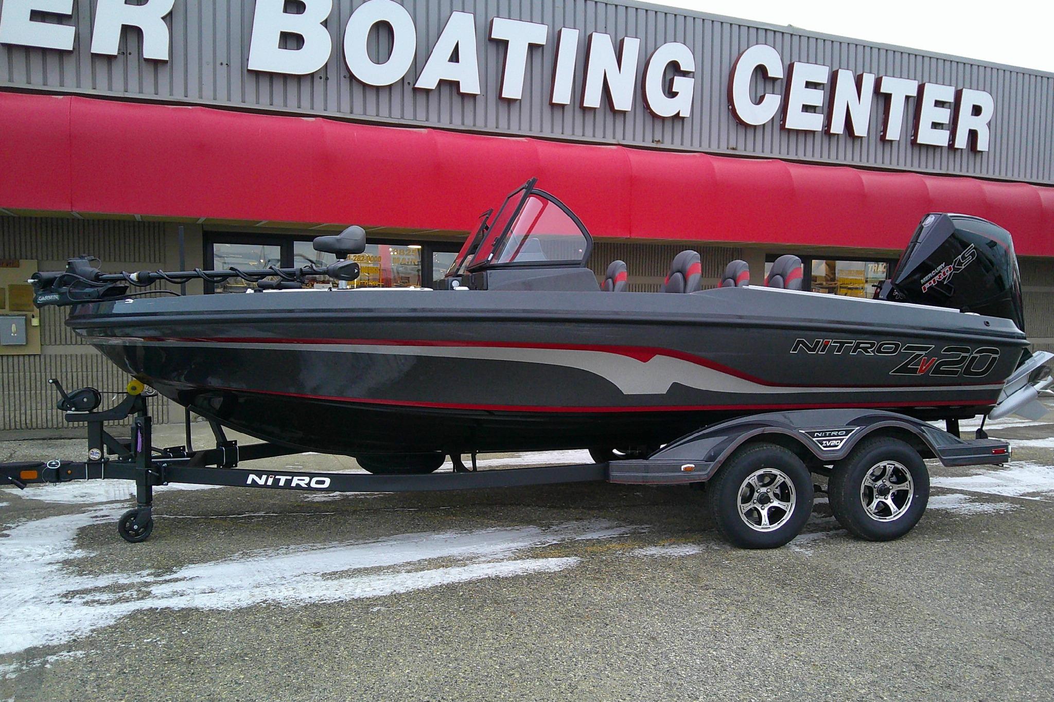 2026 Nitro ZV20 Pro boat on trailer outside boating center.