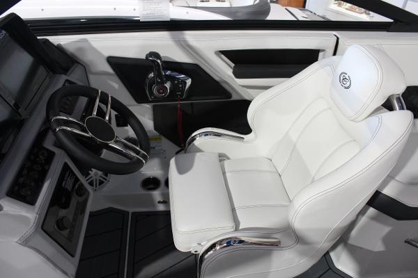 2025 Cobalt R6 boat interior with white captain's chair and modern steering console.