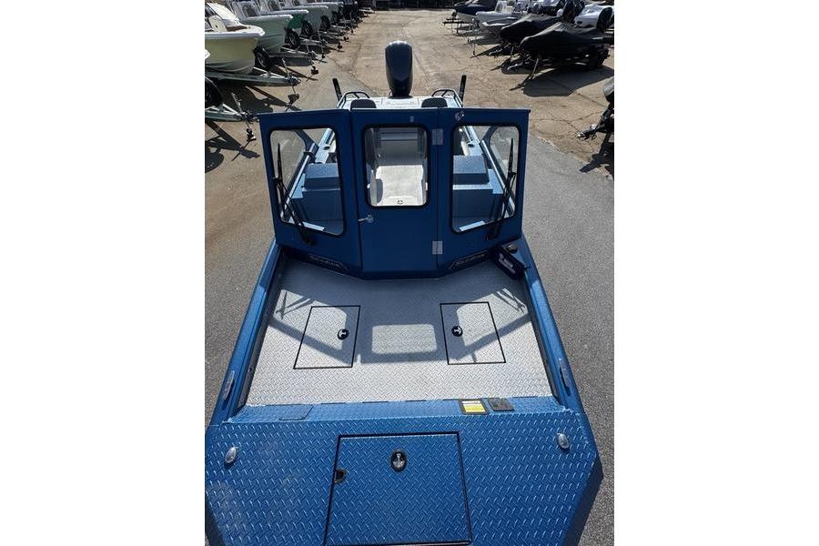 2026 SeaArk Dynasty 2.0 boat, blue exterior, spacious deck, parked outdoors.