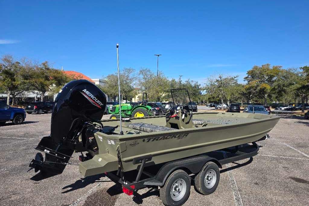 2026 Tracker Grizzly 2072 CC boat on trailer in parking lot, sunny day.