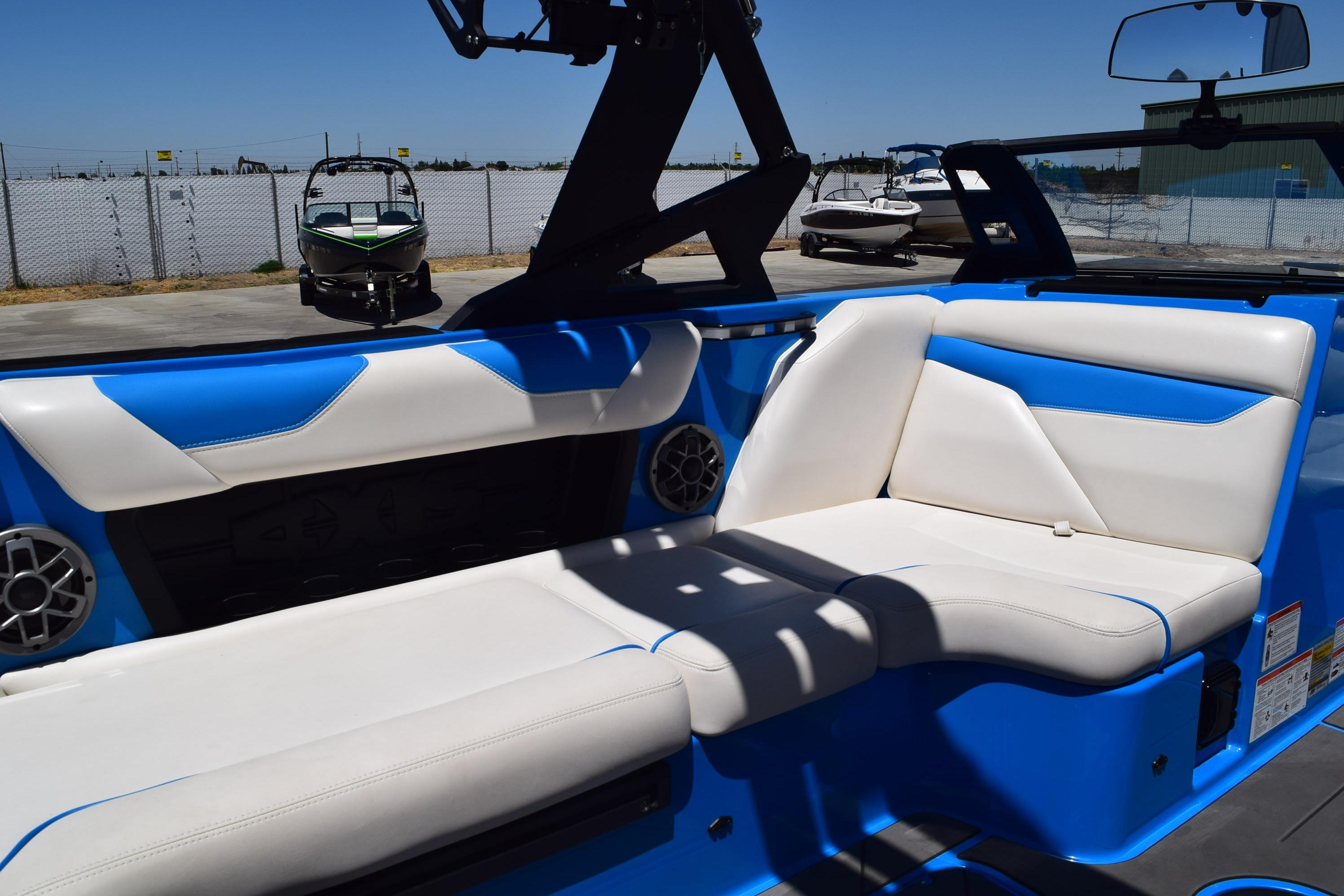 2019 Axis A22 boat interior with blue and white seating, showcasing modern design and comfort.
