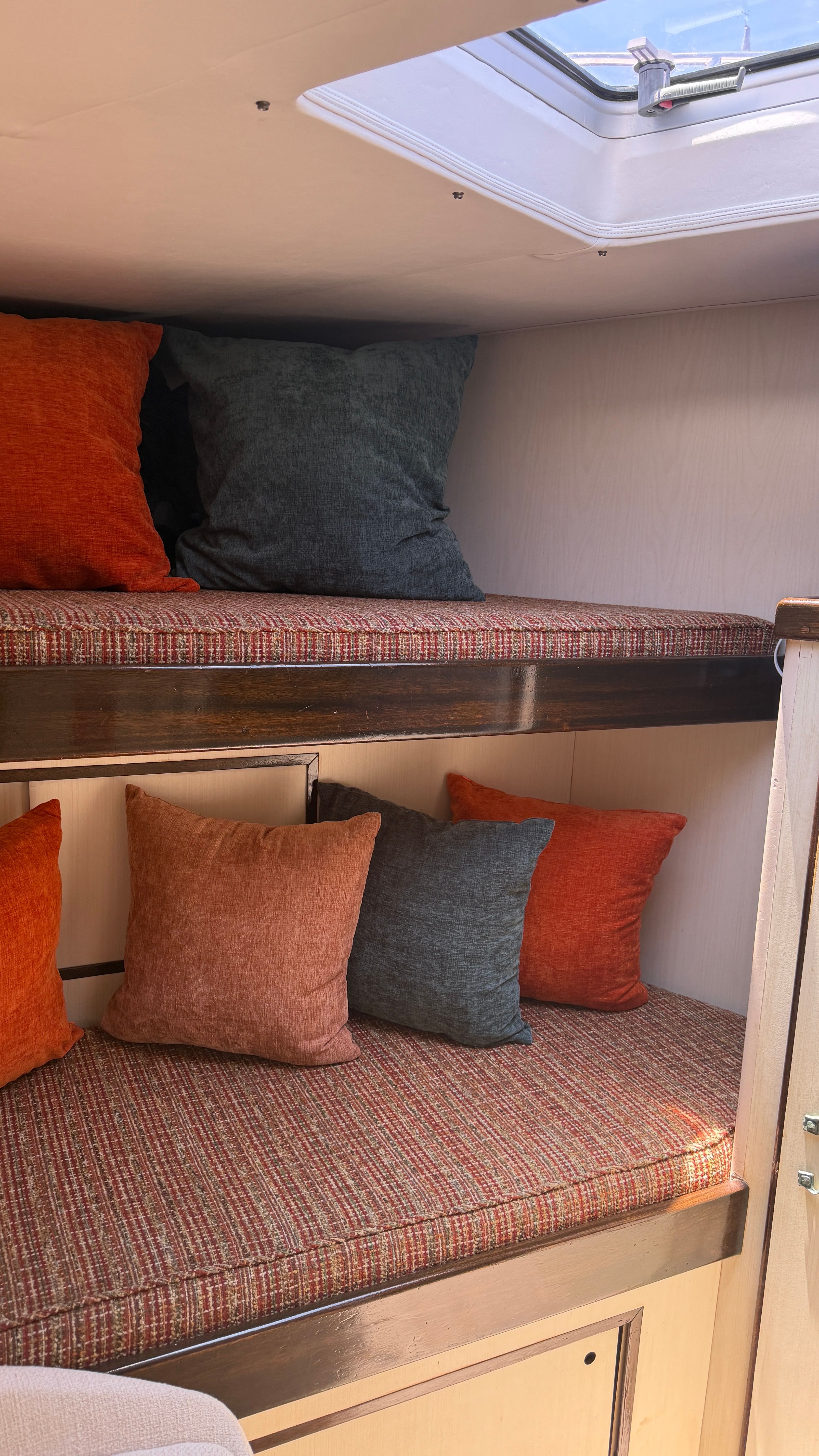 Interior of a 1966 Drake Yachtfisher with cozy cushions.