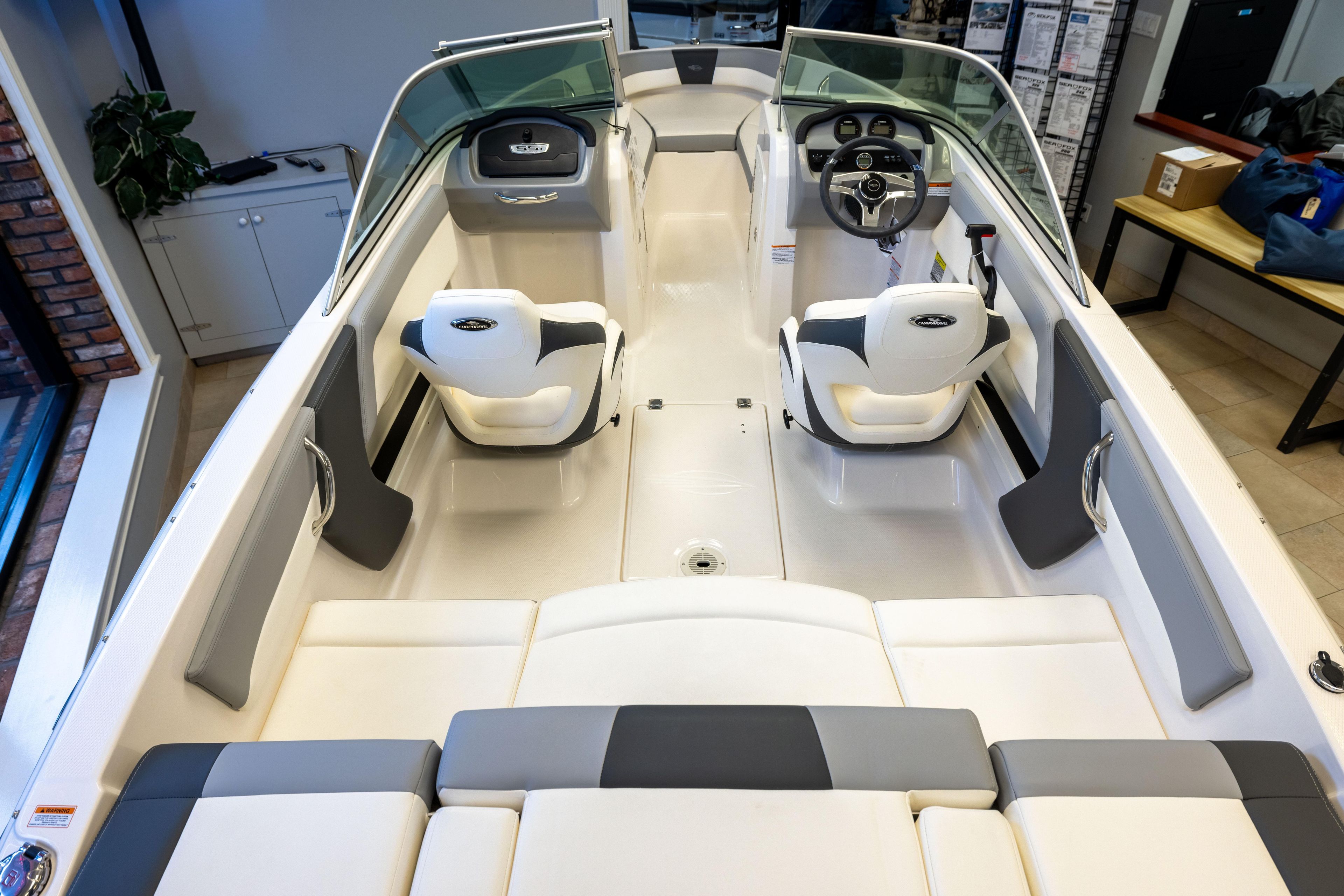 2024 Chaparral 19 SSi OB boat interior with modern seating and steering console.