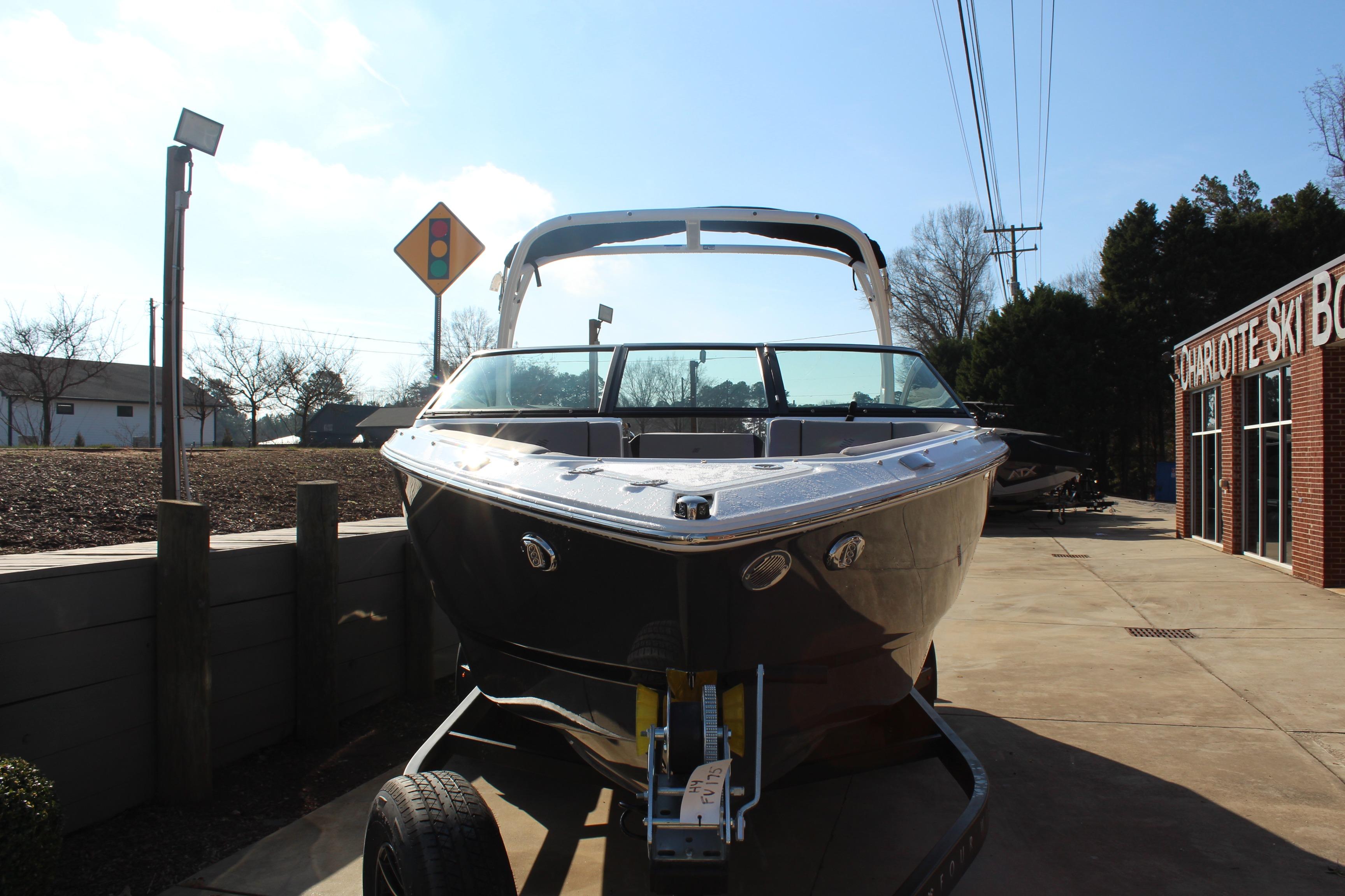 2026 Four Winns H4 boat on trailer outside Charlotte Ski Boats dealership.