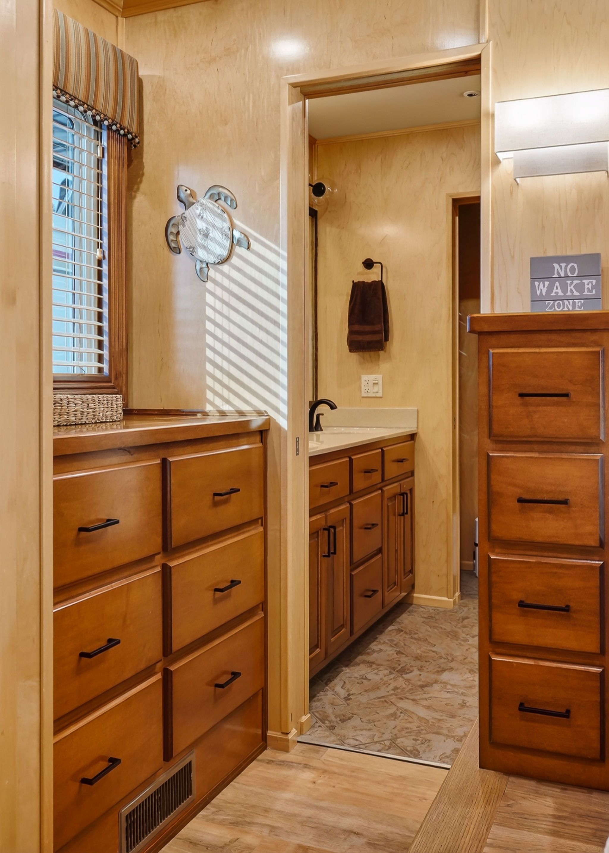 Interior of a 2010 Houseboat Throughbred with wooden cabinetry.
