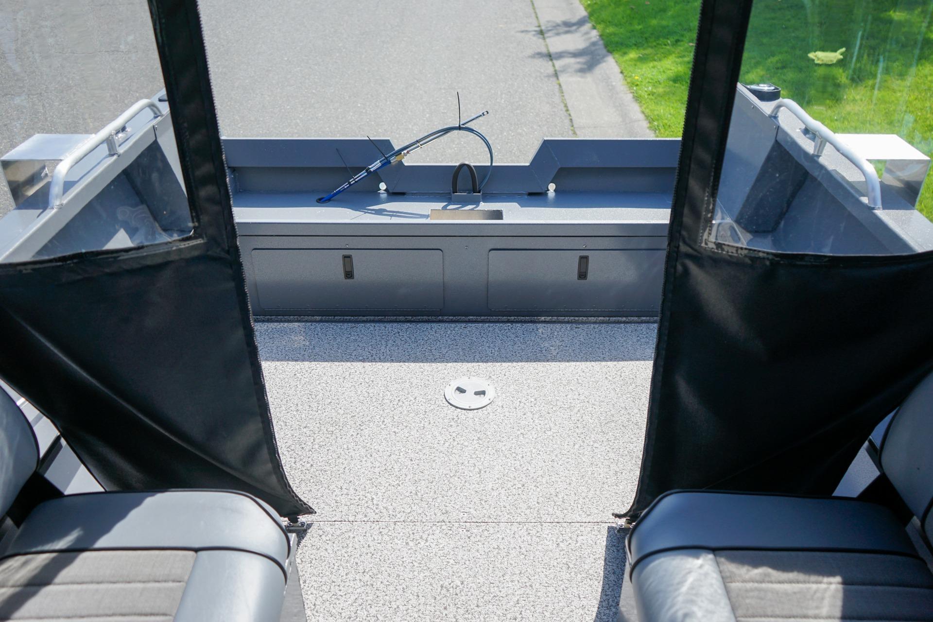2026 Alumaweld Talon 18 boat interior with seating and storage compartments.