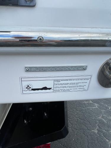 2014 Everglades 325 Center Console boat identification plate and warning label.