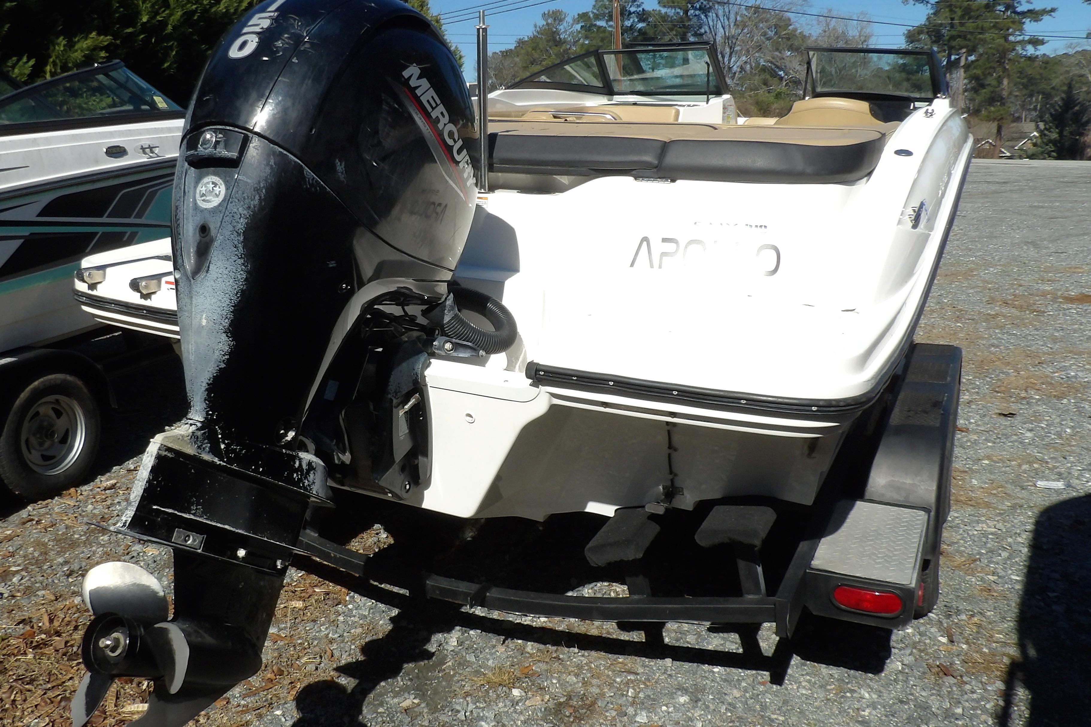 2023 Searay 210 SPO boat with Mercury outboard engine on trailer.
