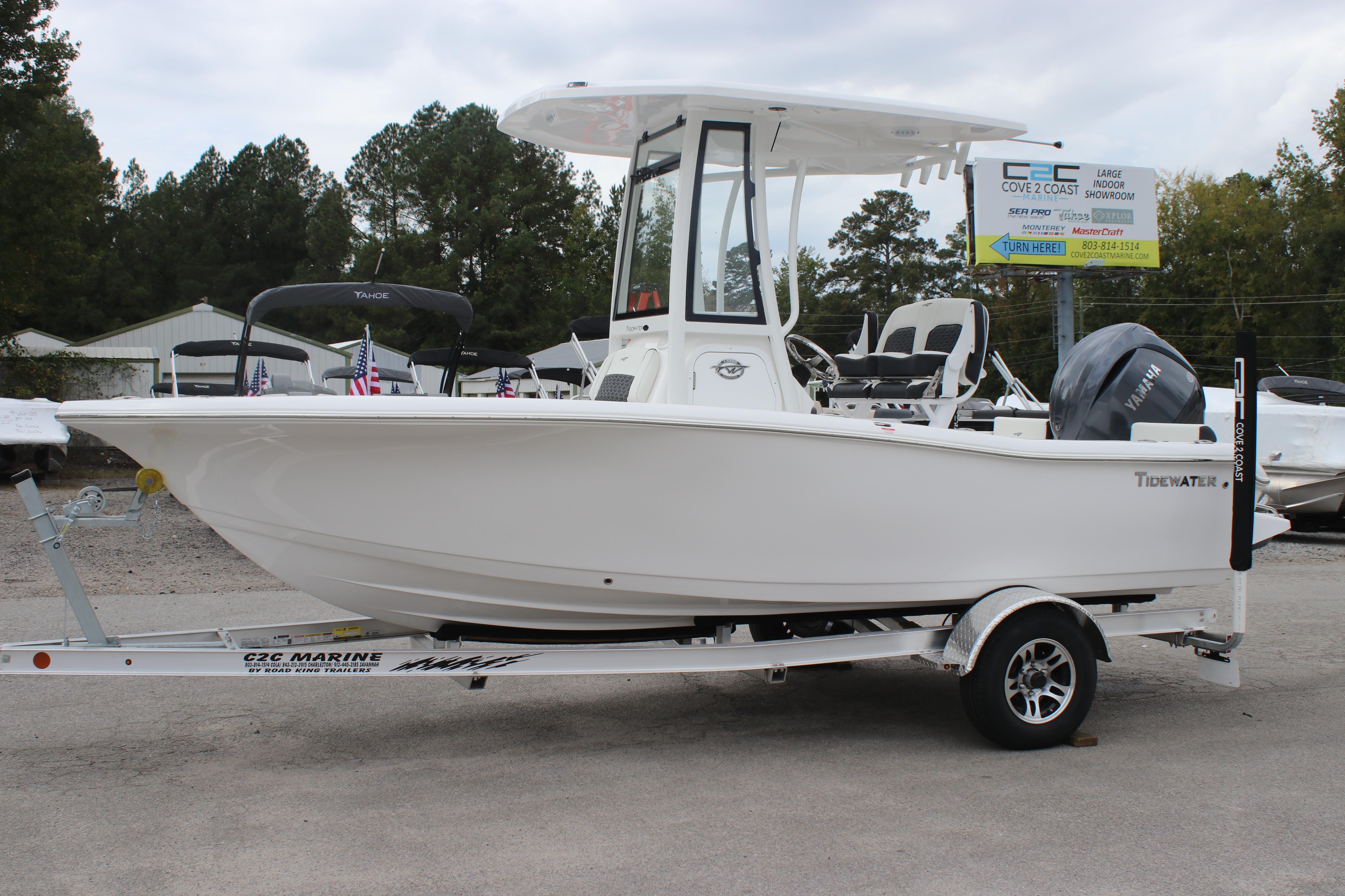 2026 Tidewater 198 CC Adventure boat on trailer, side view, outdoors.