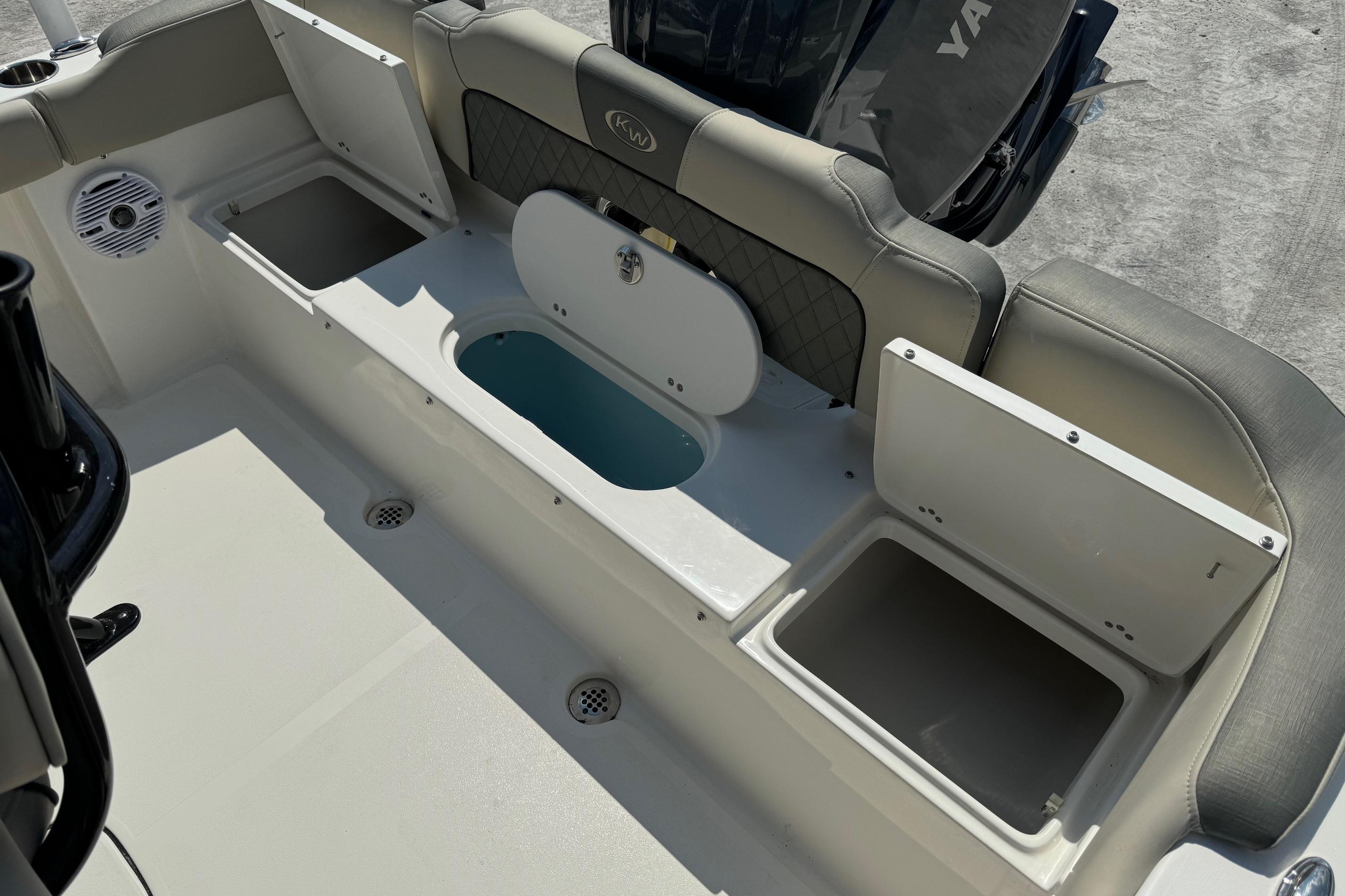 2025 Key West 203 FS boat interior with storage compartments and seating.