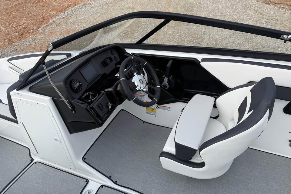 2026 Yamaha Boats SX195 cockpit with sleek steering wheel and modern dashboard design.