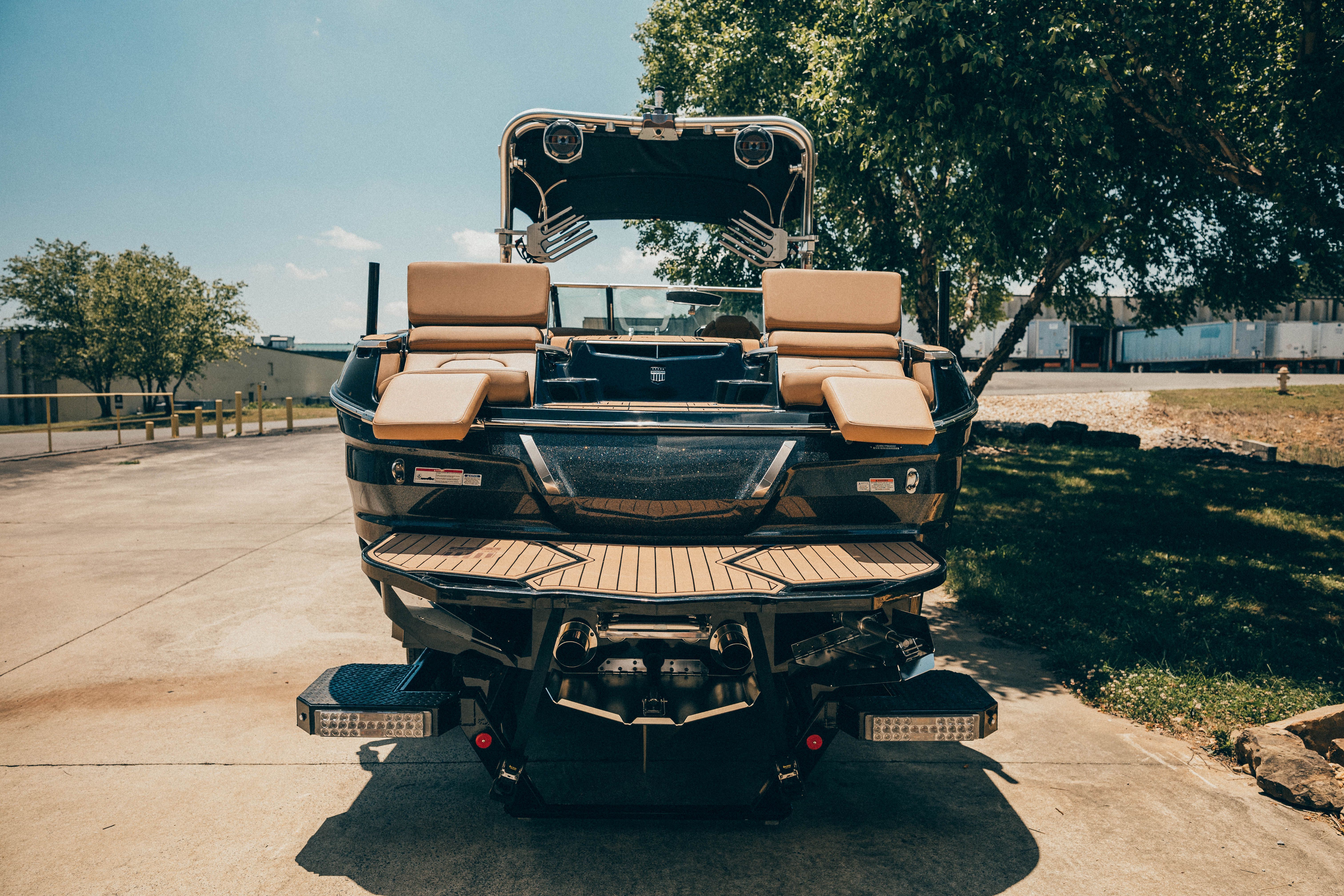Rear view of a 2021 MasterCraft X26 with luxurious seating and modern design.