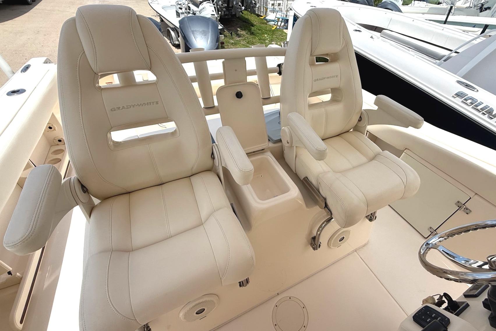 2018 Grady-White Canyon 306 boat seats, featuring luxurious white leather upholstery.