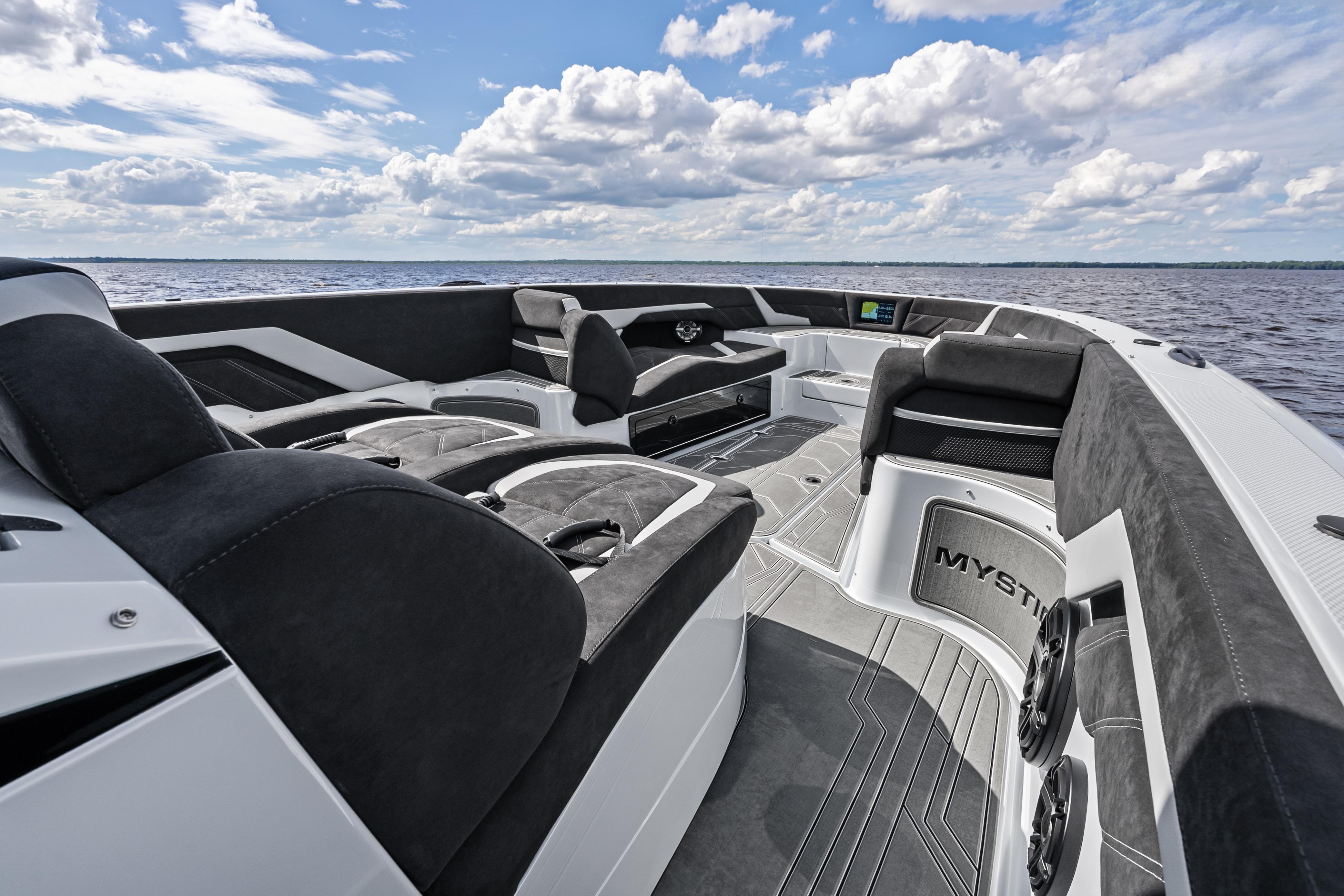 2027 Mystic Powerboats M4200 interior with luxurious seating on open water.
