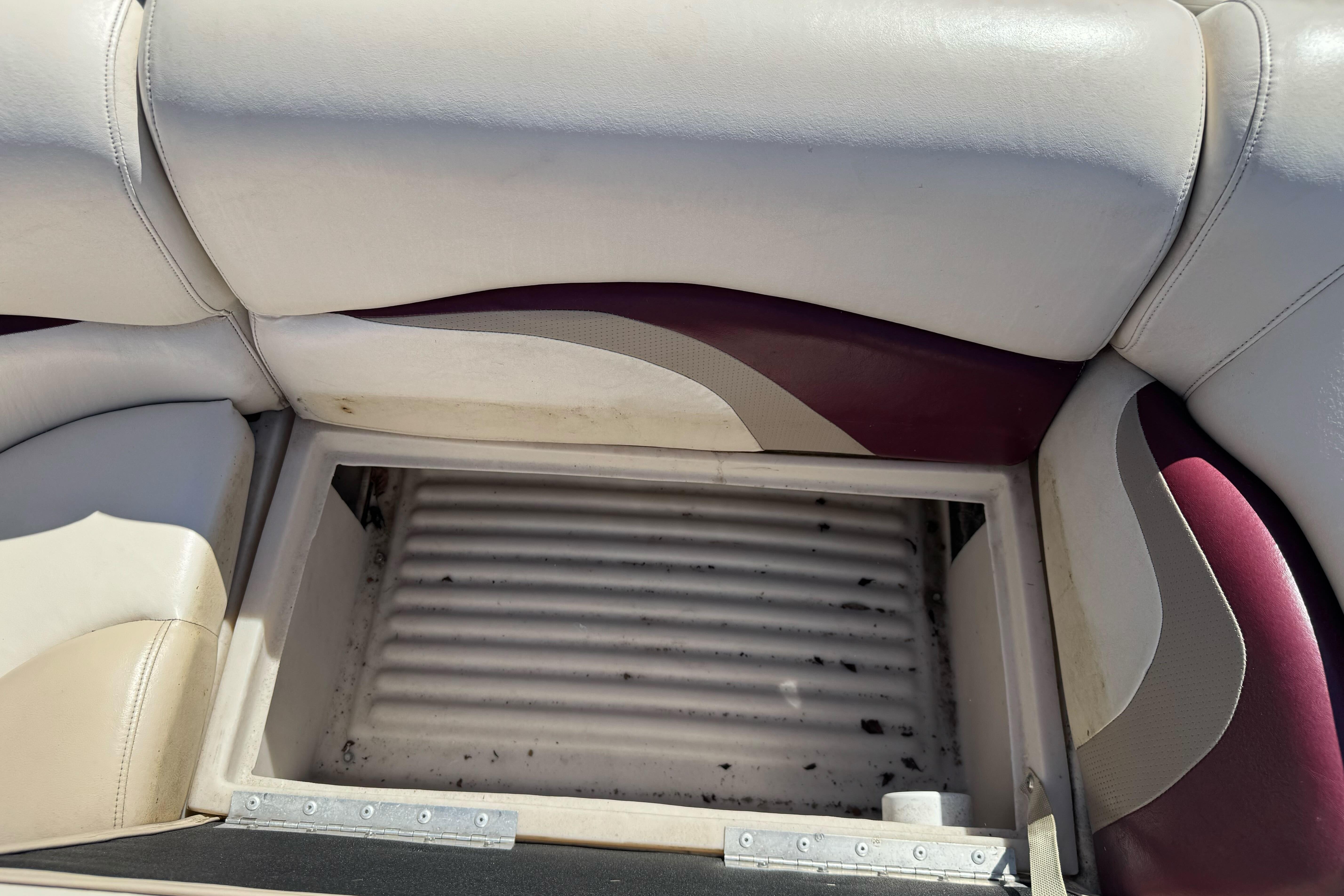Open storage compartment on 2011 Sun Tracker Party Barge 21 boat seat.