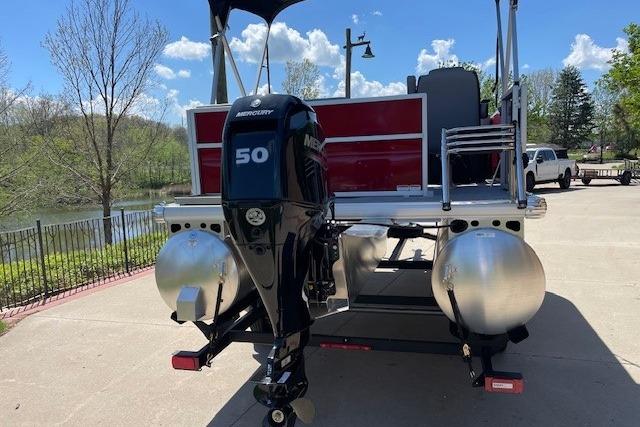 2026 Sun Tracker Party Barge 16 DLX with Mercury 50 engine, parked near a lake.