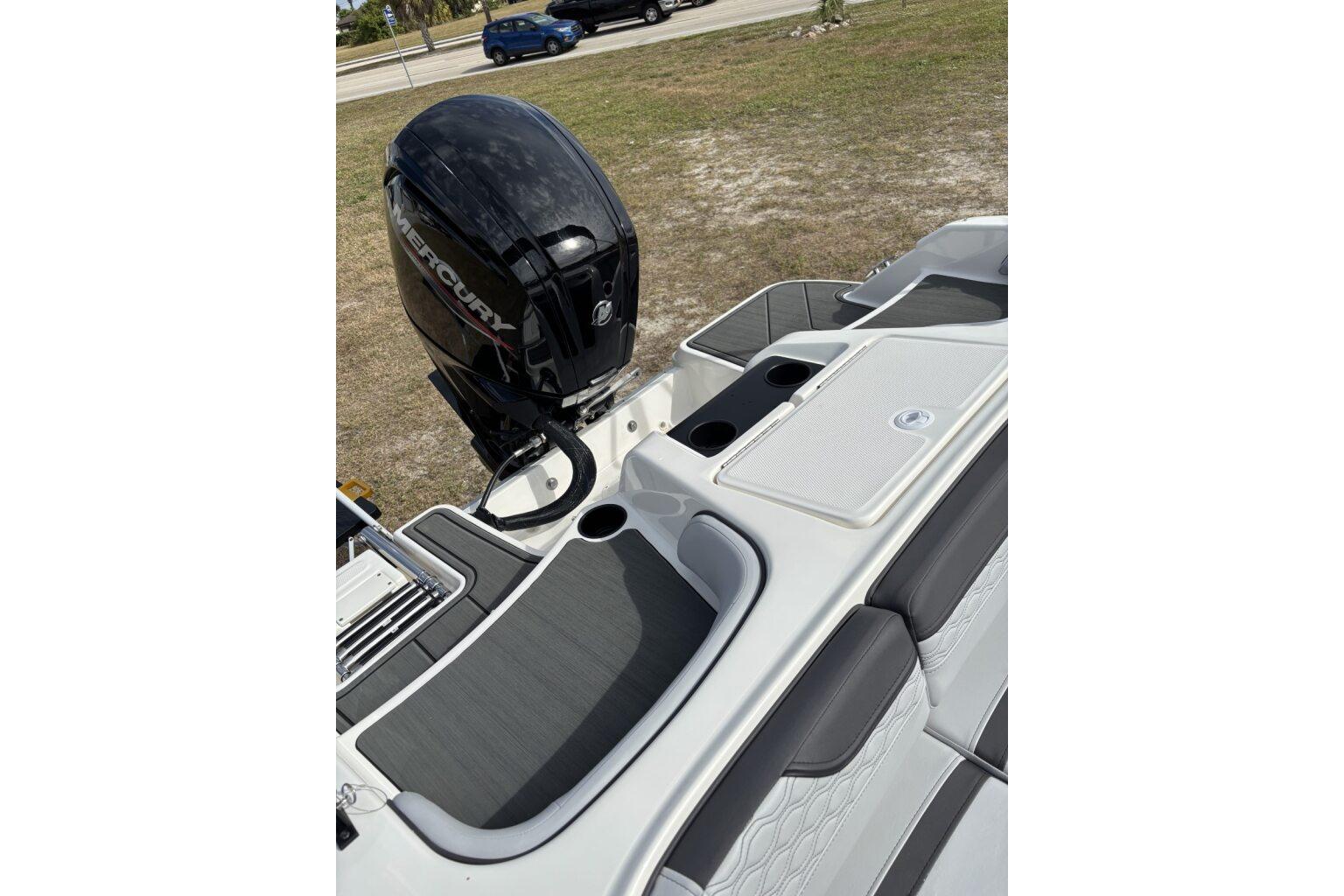 2025 Bayliner Element M17 boat with Mercury outboard motor, featuring sleek seating and storage.