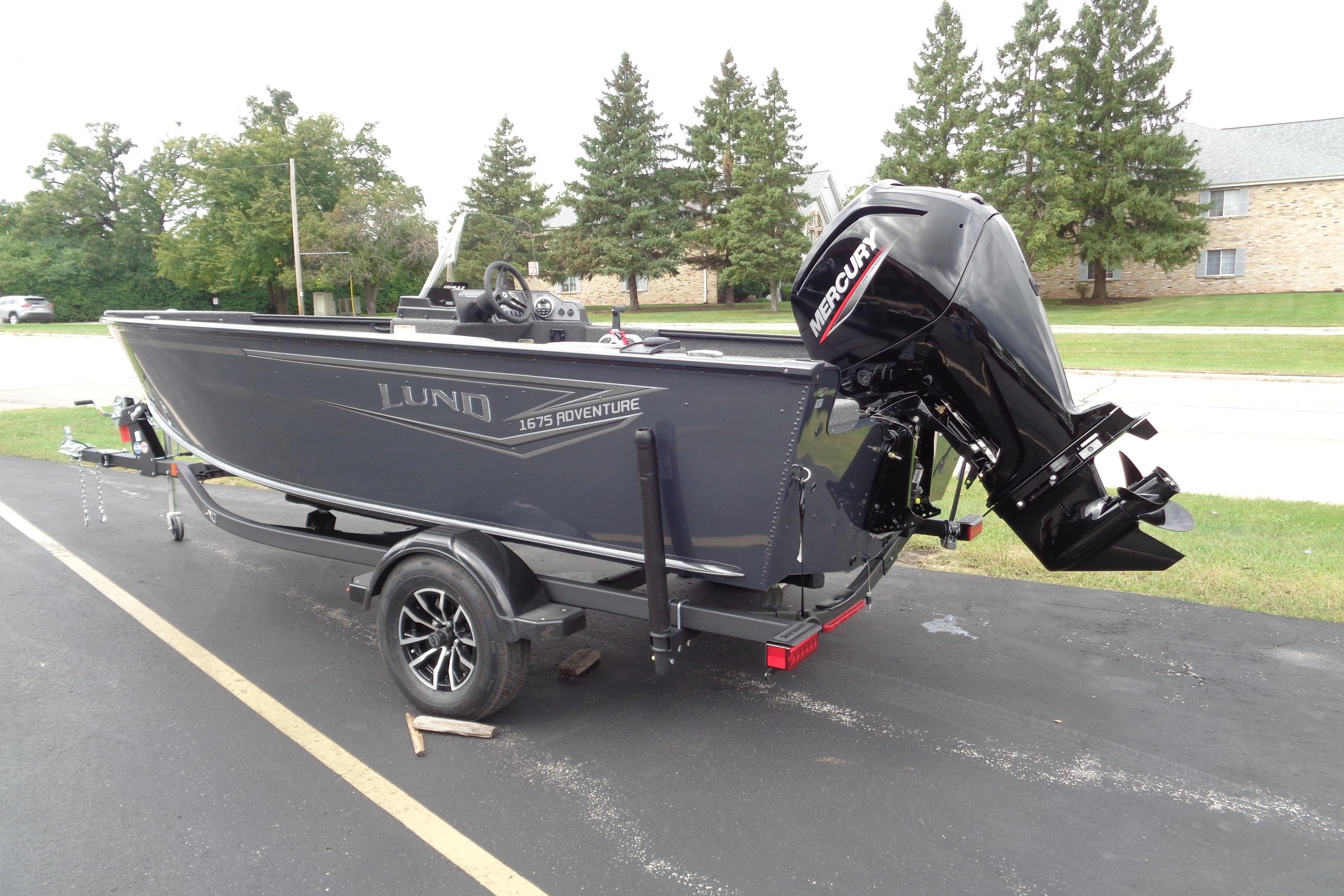 2026 Lund 1675 Adventure SS boat with Mercury outboard motor on a trailer.