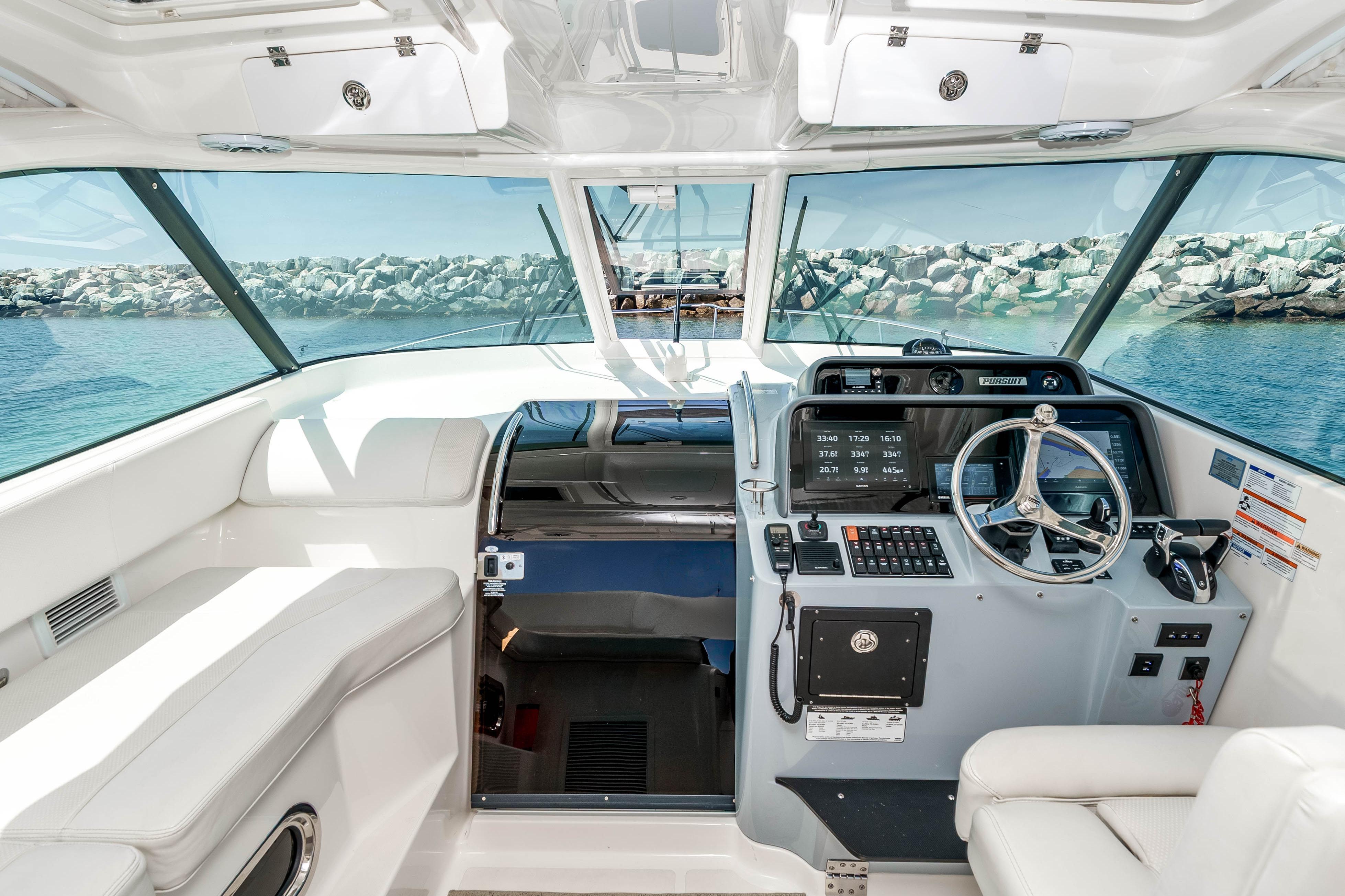 2022 Pursuit OS 385 Offshore helm with modern controls and panoramic ocean view.