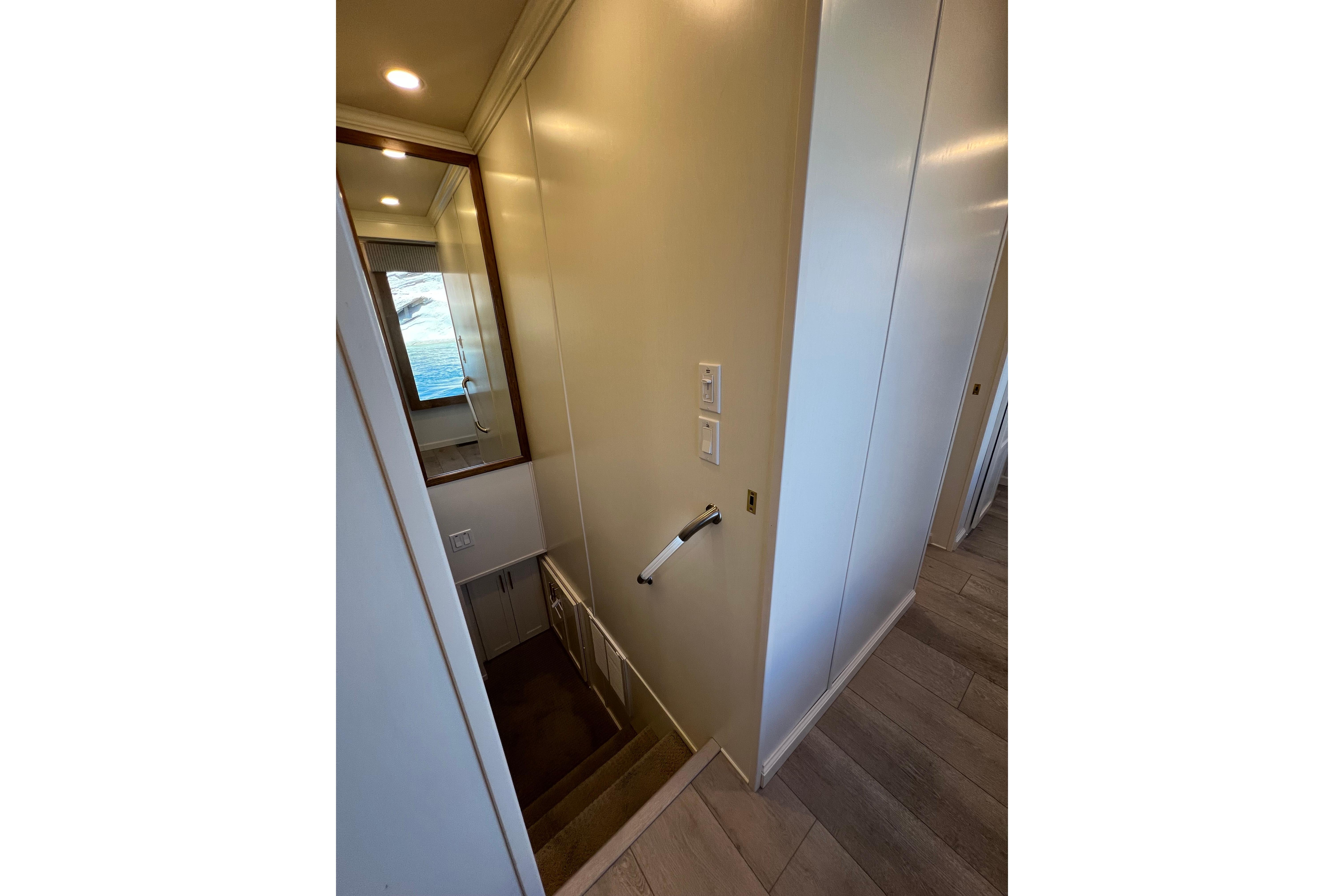 Staircase in 2025 Sumerset Excellence Multiple Shares houseboat, featuring modern interior design.