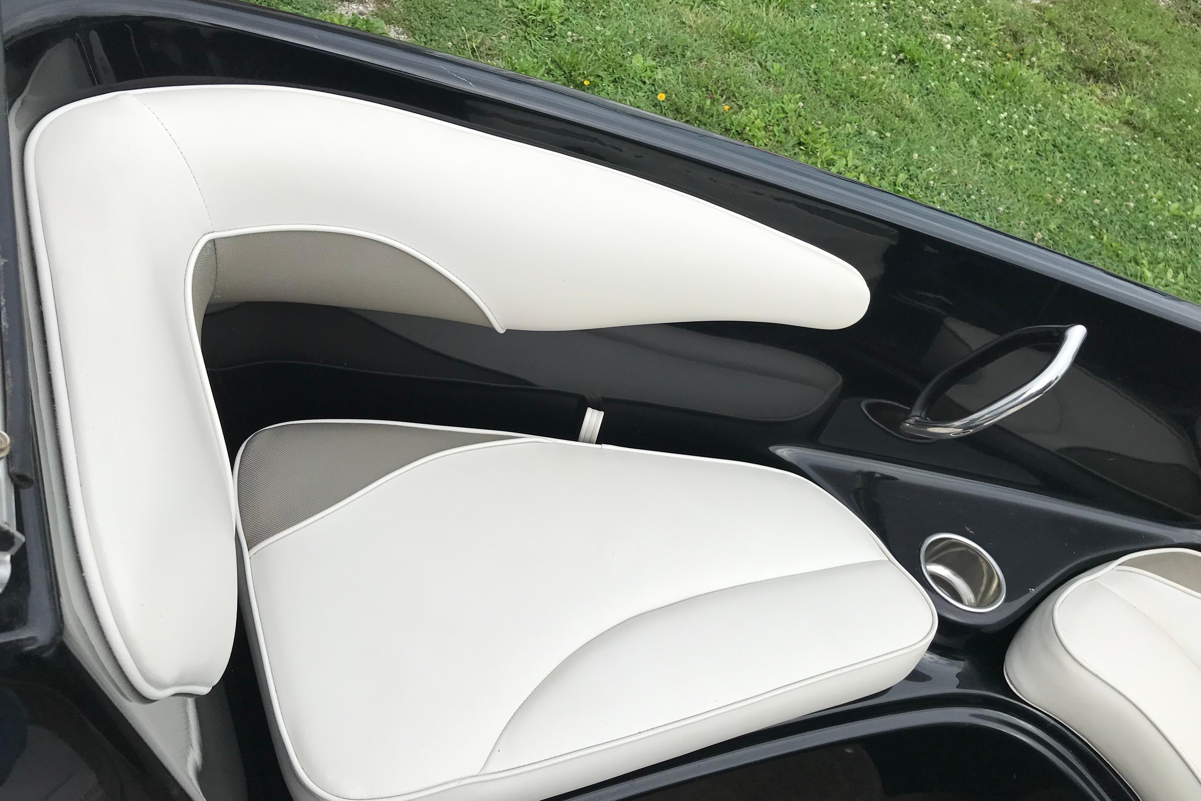 2015 Crownline 18 SS boat interior with white seating and sleek design.