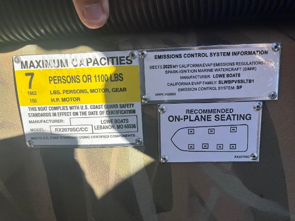 Capacity and emissions labels on 2025 Lowe Roughneck 2070 SC boat.