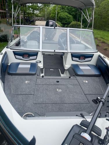 2025 Ranger 1850MS boat interior with seating and windshield, featuring modern design and spacious layout.