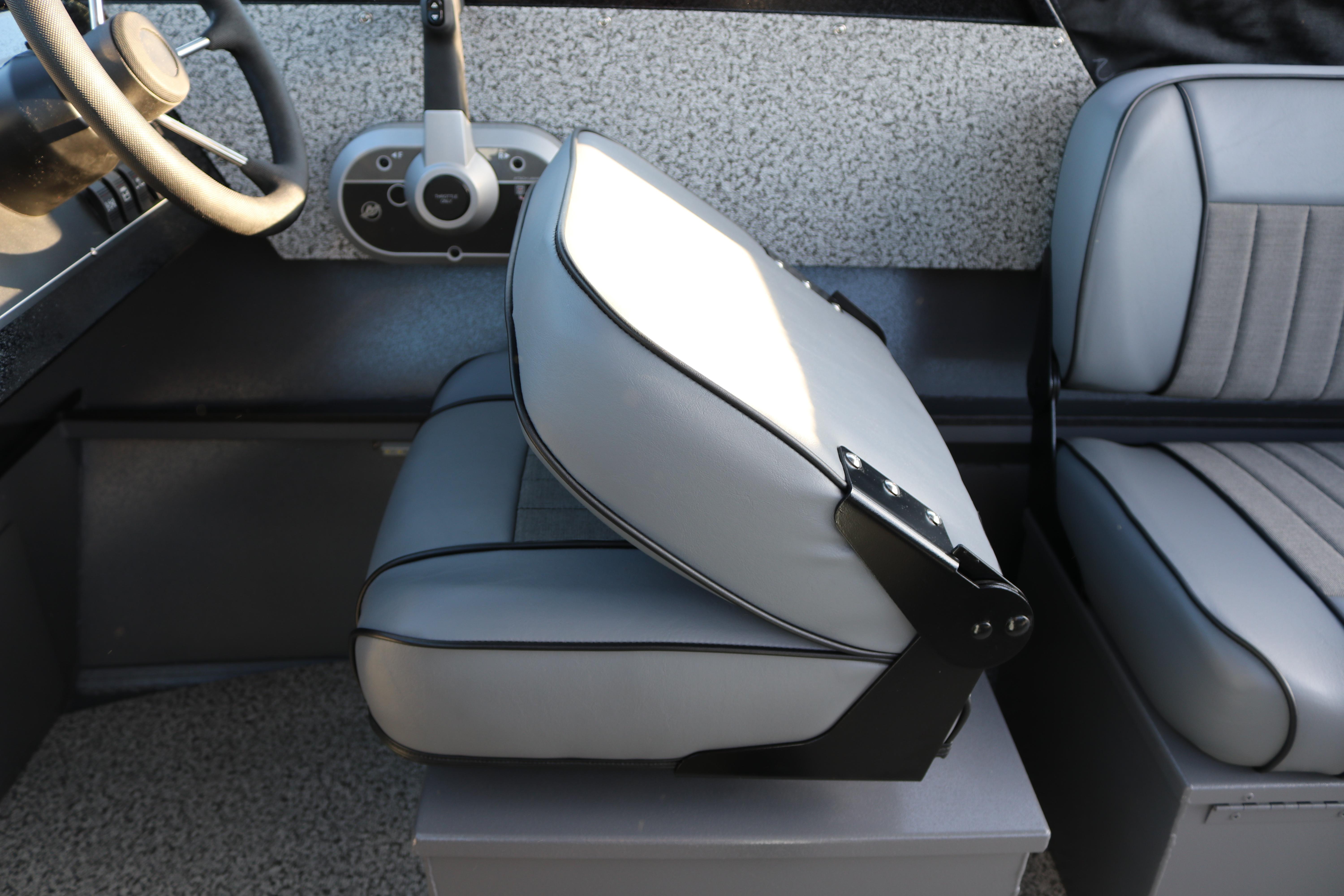 2026 Alumaweld Stryker X202 boat interior with gray seating and steering wheel.