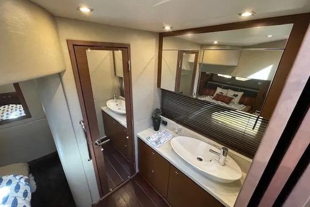 Luxurious bathroom interior of 2016 Sea Ray Sundancer 510 yacht with modern fixtures.