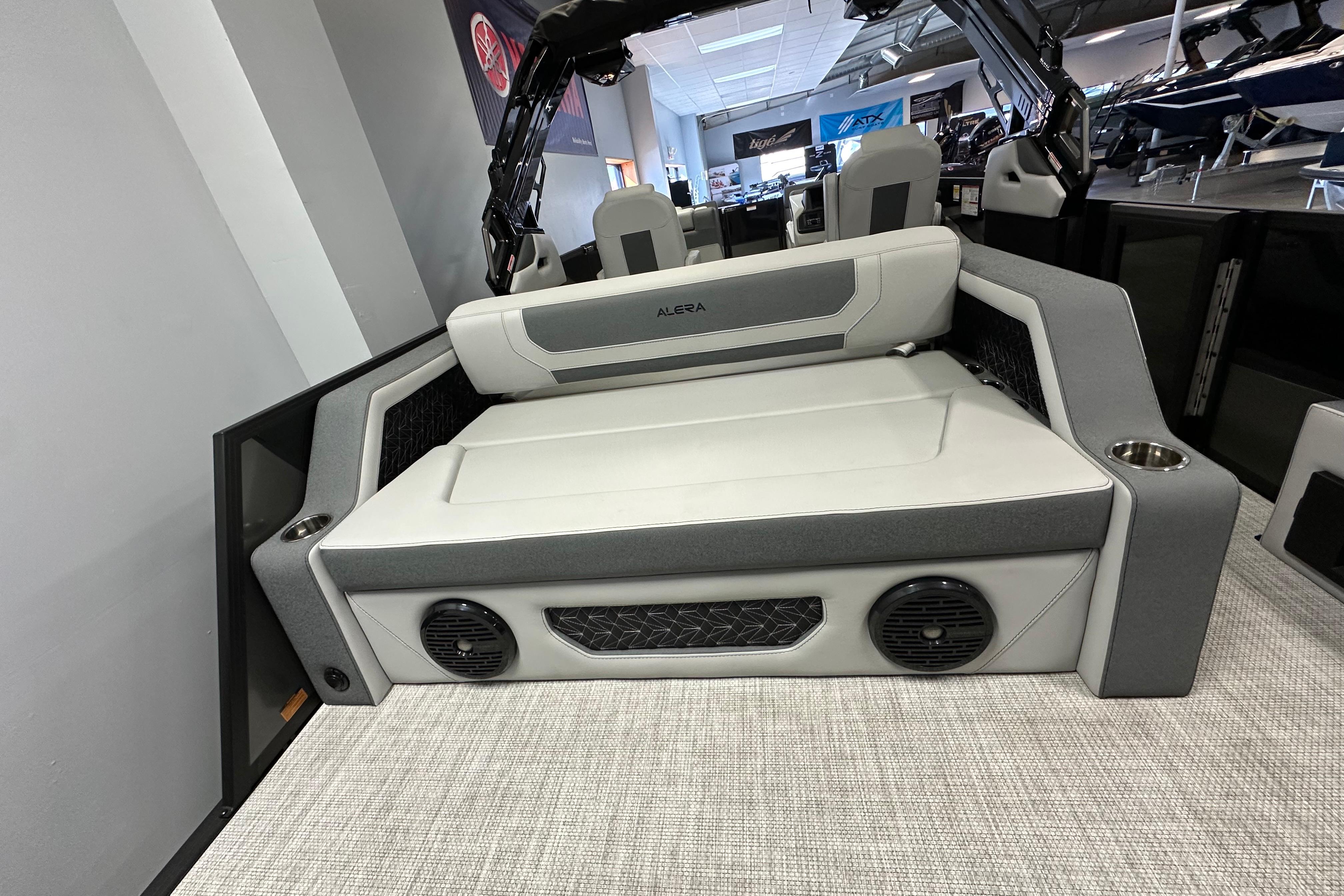 2026 Alera M25L boat interior with cushioned seating and integrated speakers.