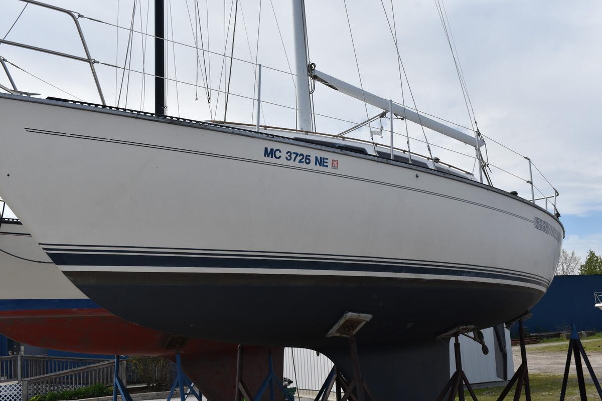 A 1987 S2 9.2A sailboat is on a dry dock.