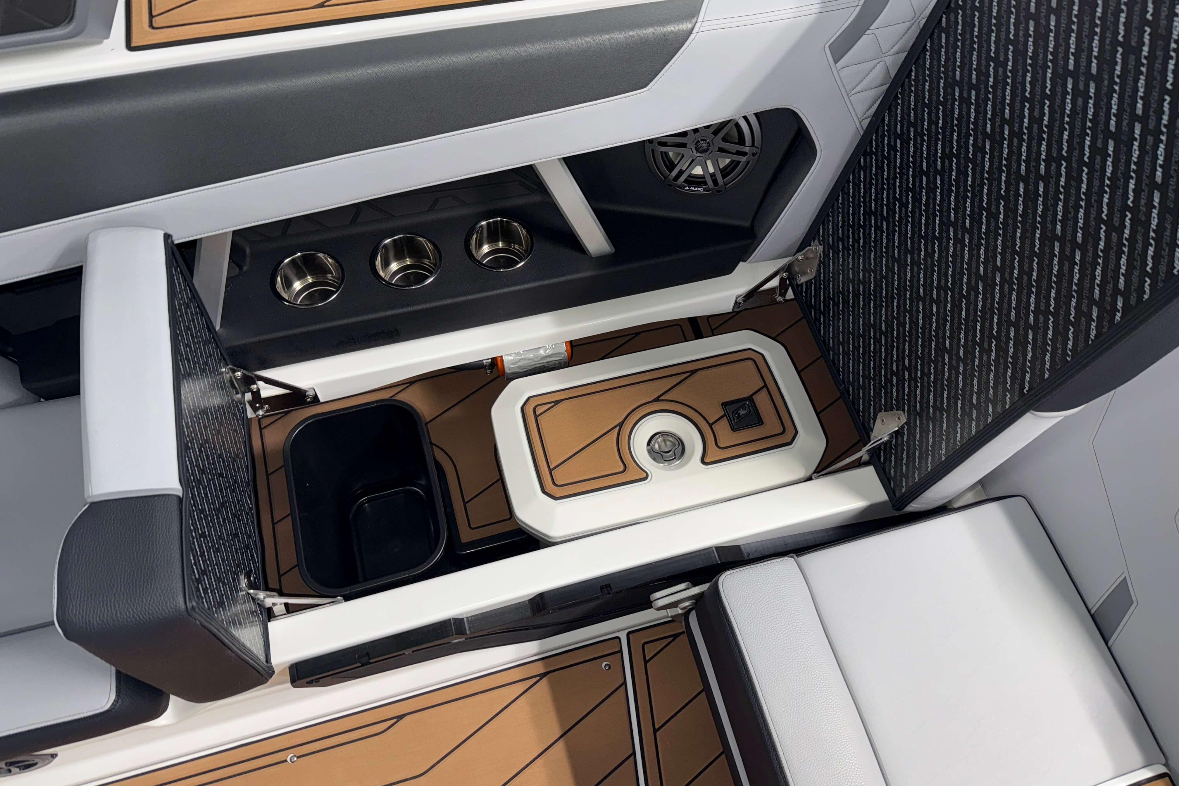 2026 Nautique Super Air Nautique GS22 interior with storage and cup holders.