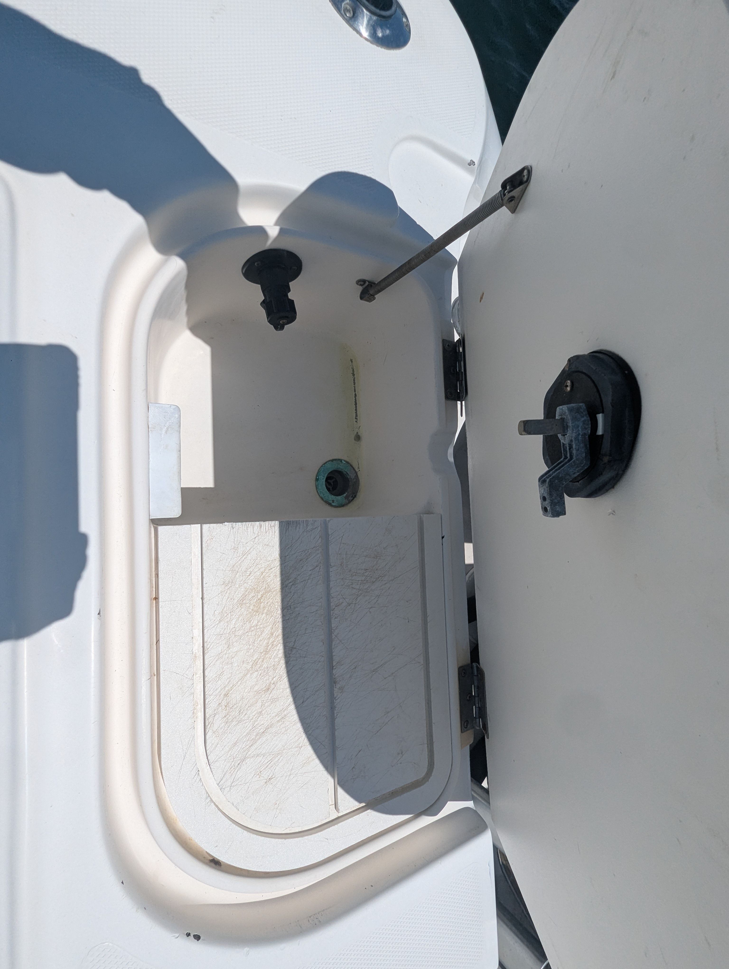 Open storage compartment on a 2005 Wellcraft 35 CCF boat.