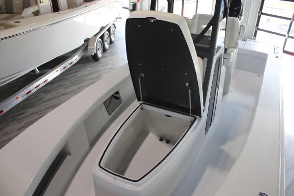 2025 East Cape 25 Open boat interior with open storage compartment.