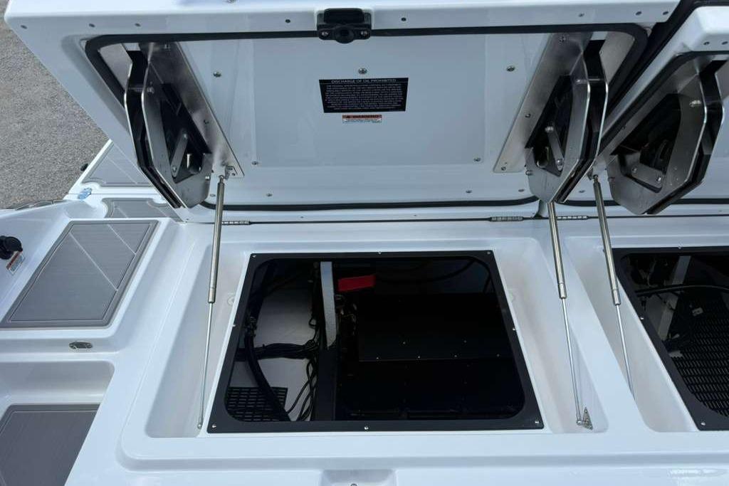 Open storage compartment of 2026 Monterey Elite 30 OB boat.