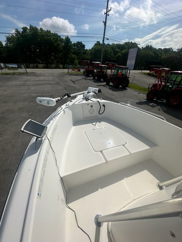 A 2009 Century 2001 Center Console boat is parked on a lot. It features a clean, white deck.