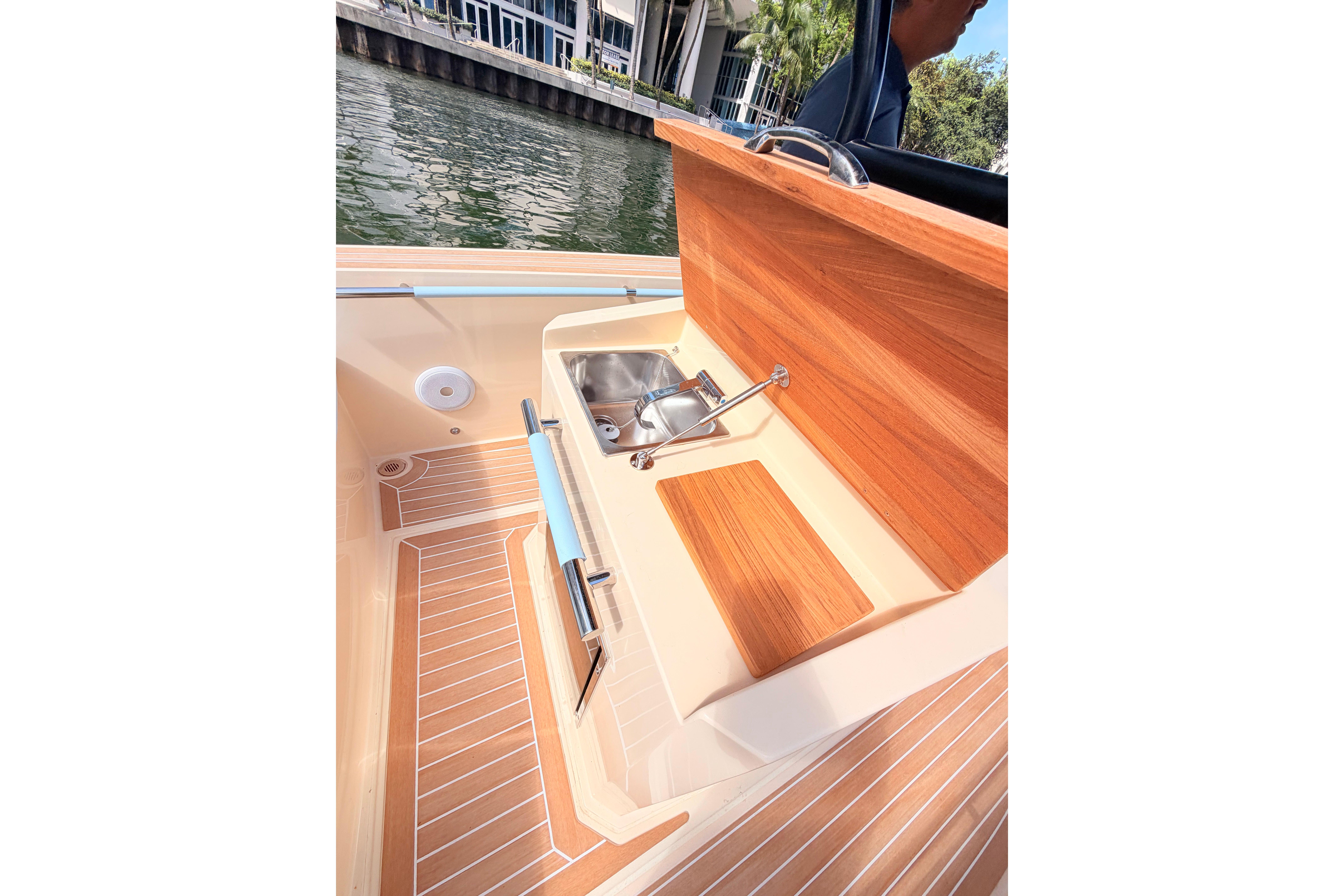 Lilybaeum Levanzo 25 boat interior with wooden sink area, 2026 model.
