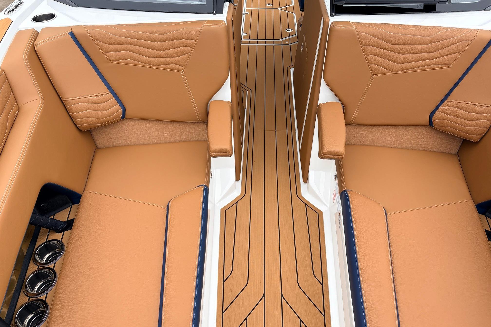 Luxurious interior of 2026 Nautique Super Air Nautique G25 with tan leather seating.