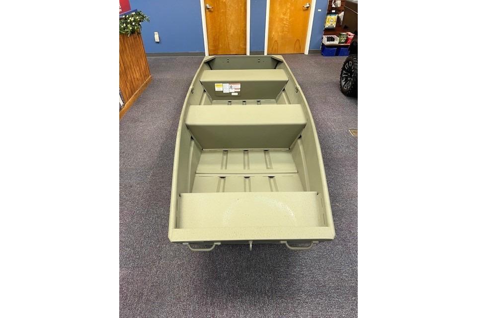 2025 Tracker Grizzly 12 Jon boat displayed indoors, featuring a simple, sturdy design.