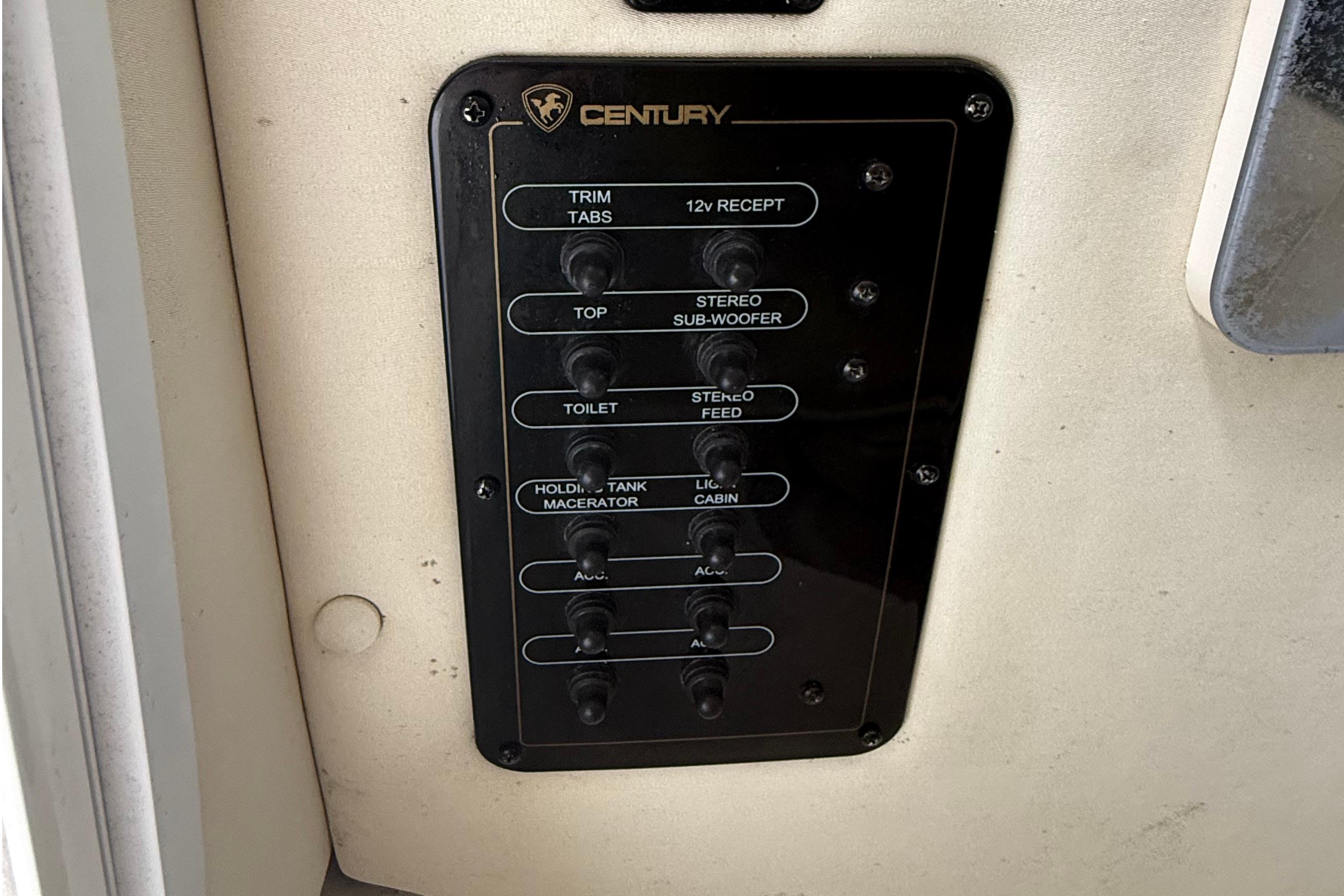 Control panel of a 2008 Century 2901 Center Console boat with labeled switches.