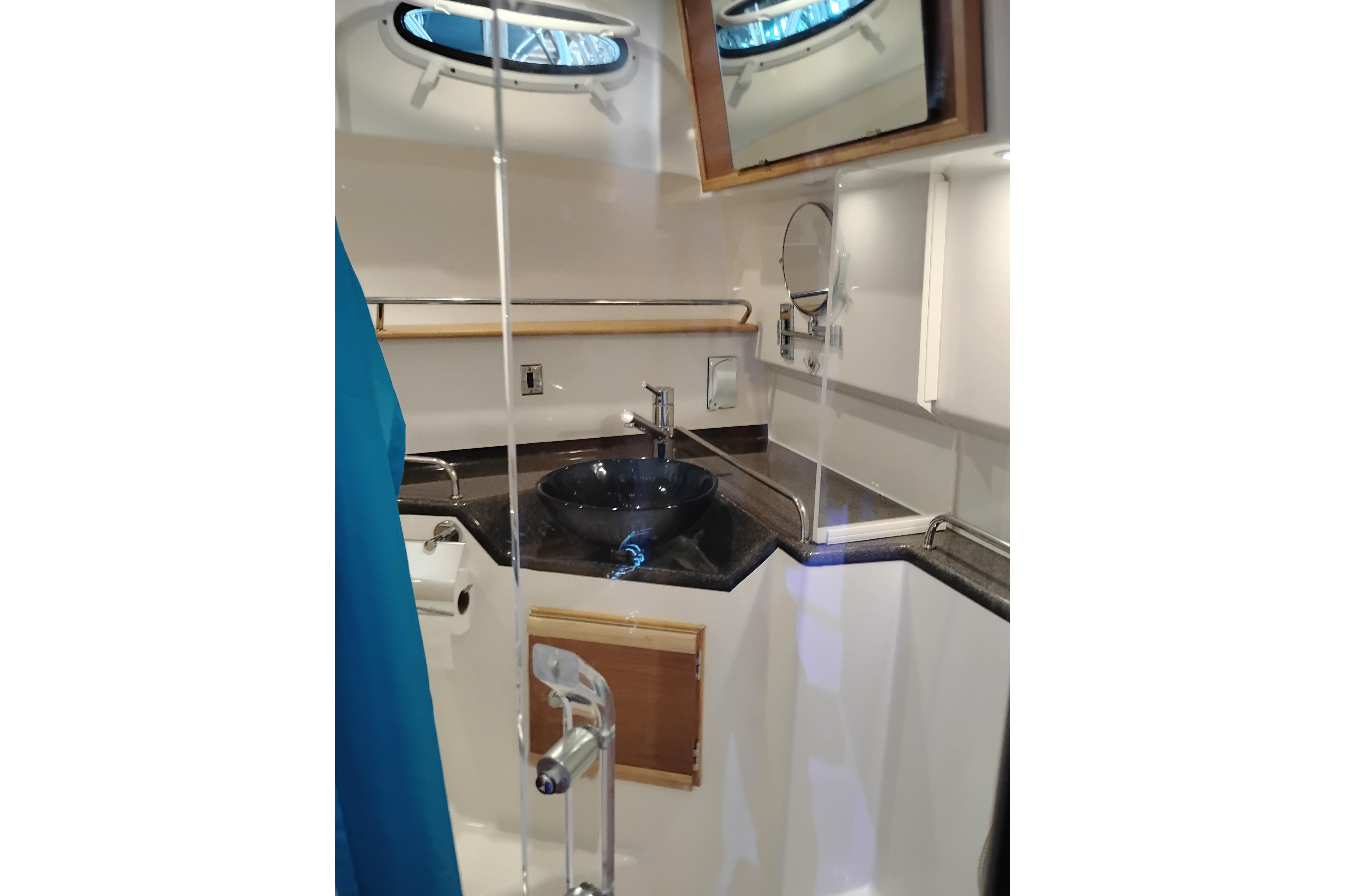 2022 Cutwater C-32 Coupe bathroom with modern sink and mirror.