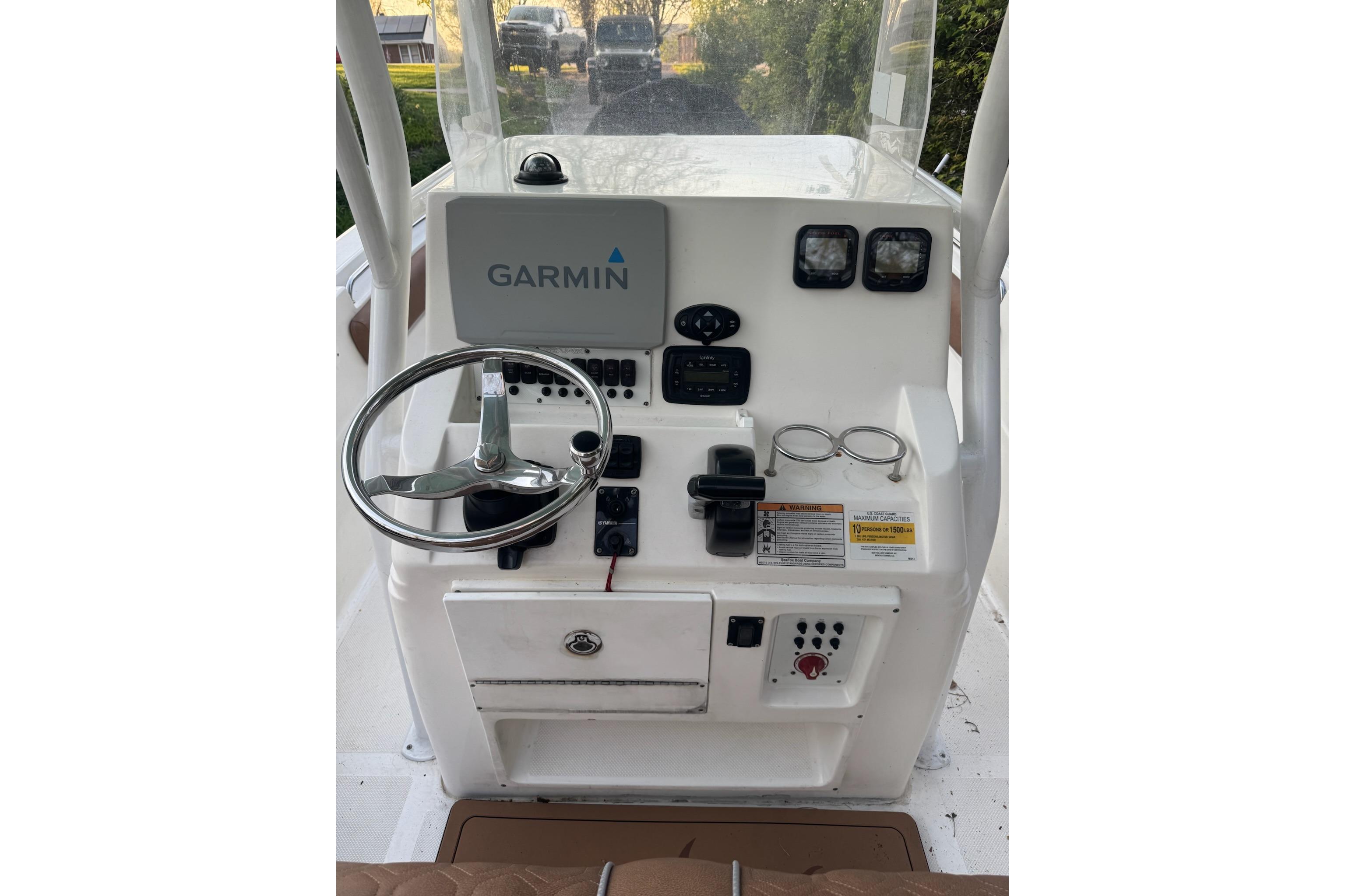 2013 Sea Fox 246 Commander boat console with Garmin navigation system and steering wheel.