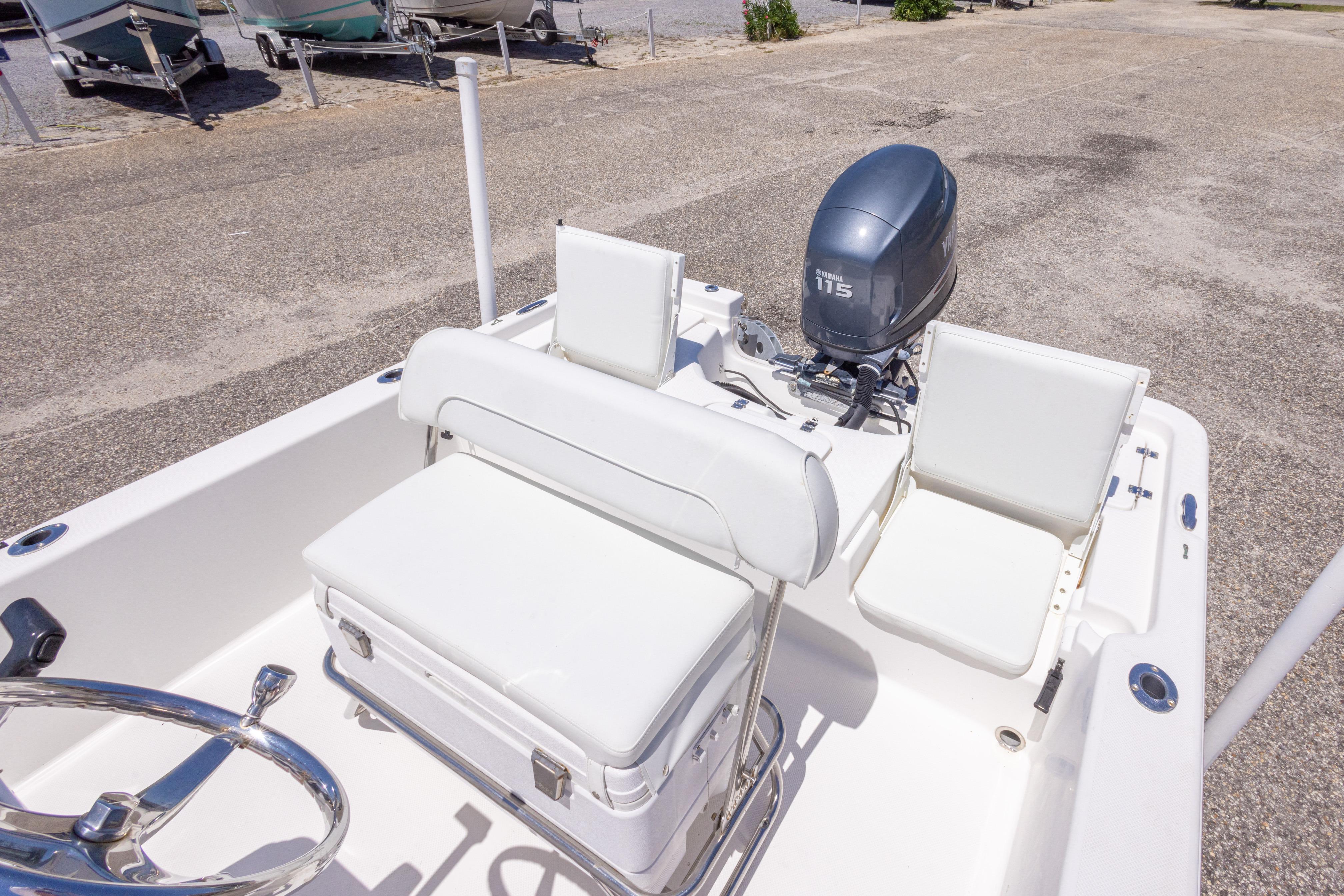 2011 Sea Fox 200XT boat interior with Yamaha 115 engine, featuring white seating and steering wheel.