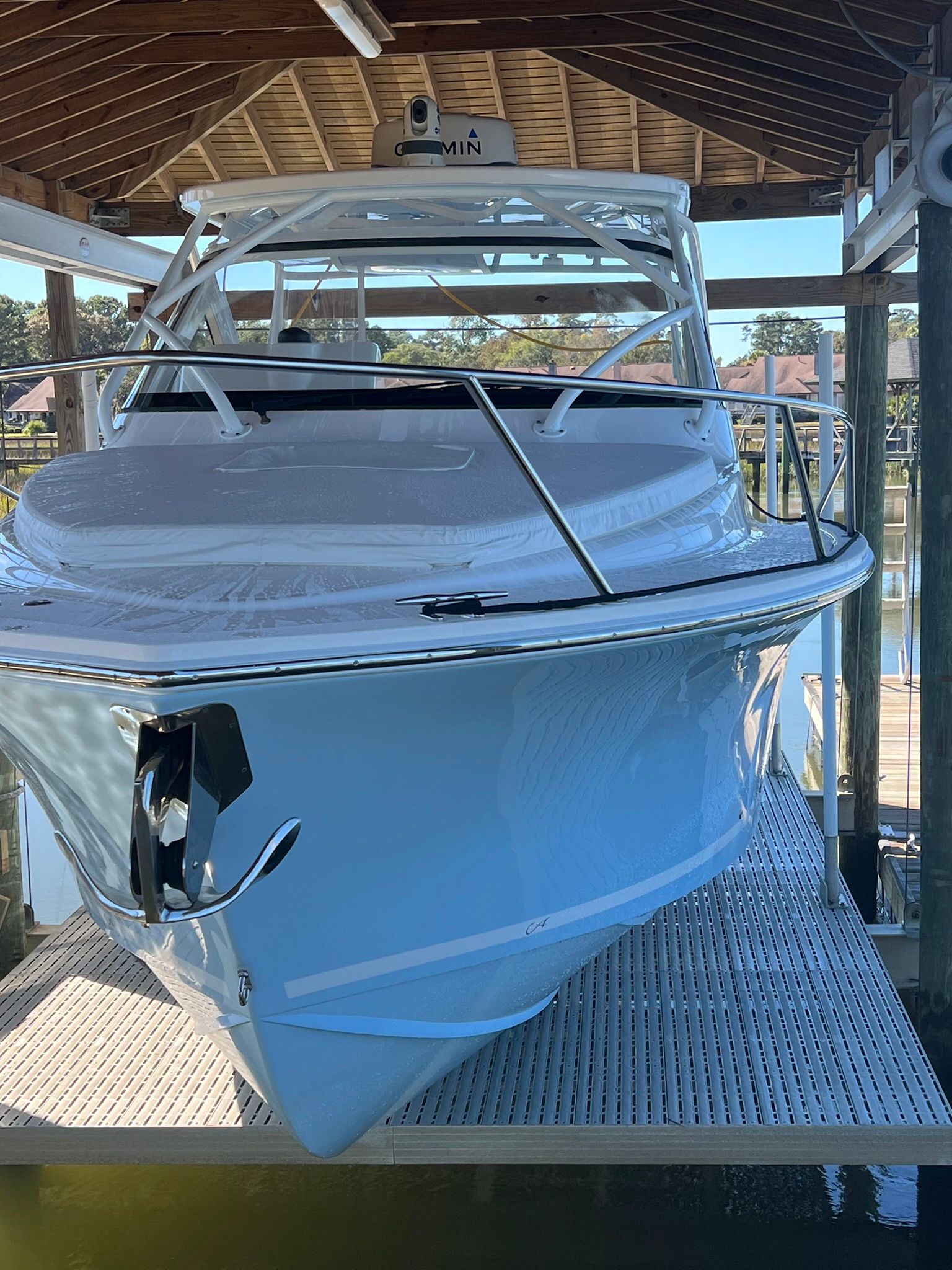 A 2024 Albemarle 30 Express boat in a covered dock.