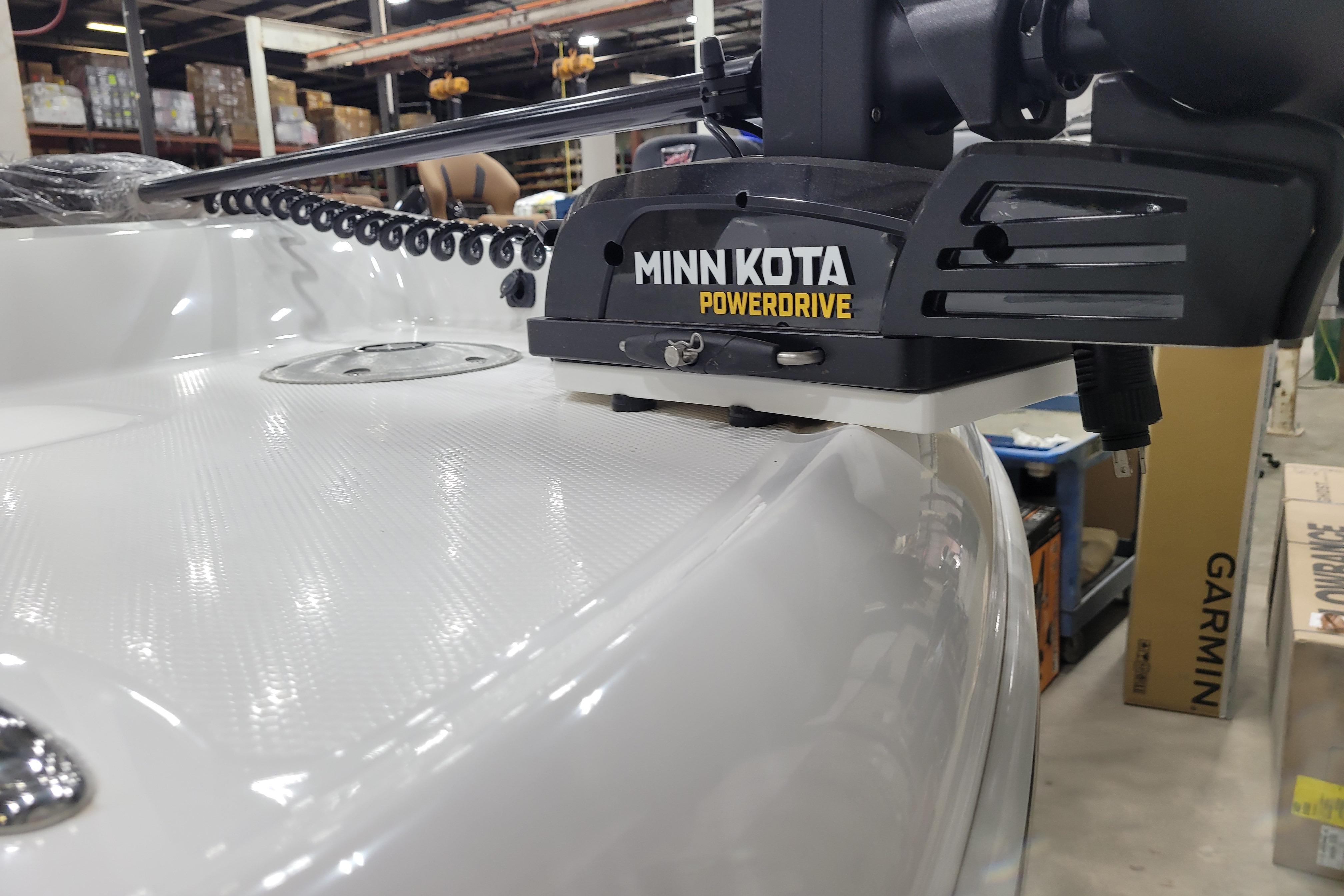 Minn Kota PowerDrive mounted on 2026 Tahoe 2150 boat in a workshop setting.